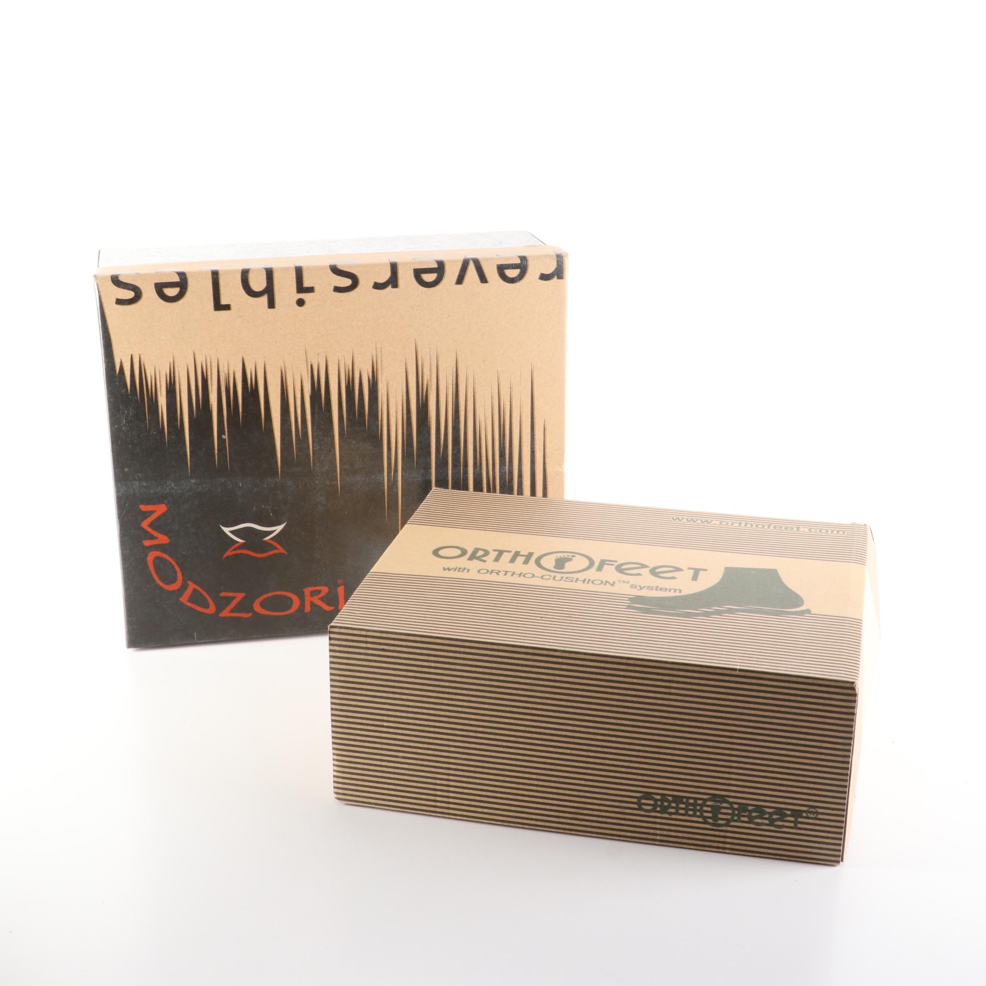 Modzori Jane Reversibles Short Boots in Black and Orthofeet Boots in Brown