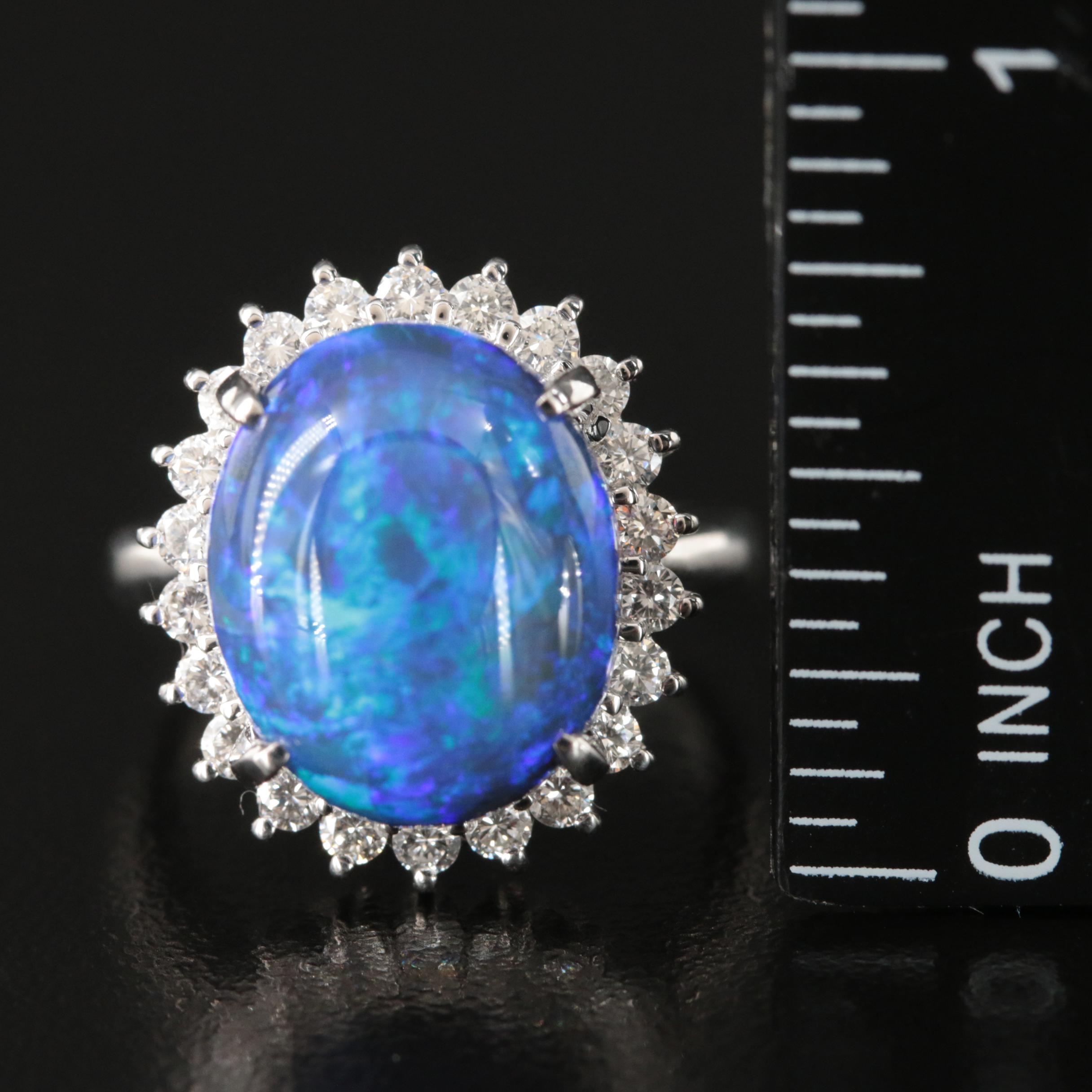 Platinum 10.16 CT Black Opal and Diamond Halo Ring