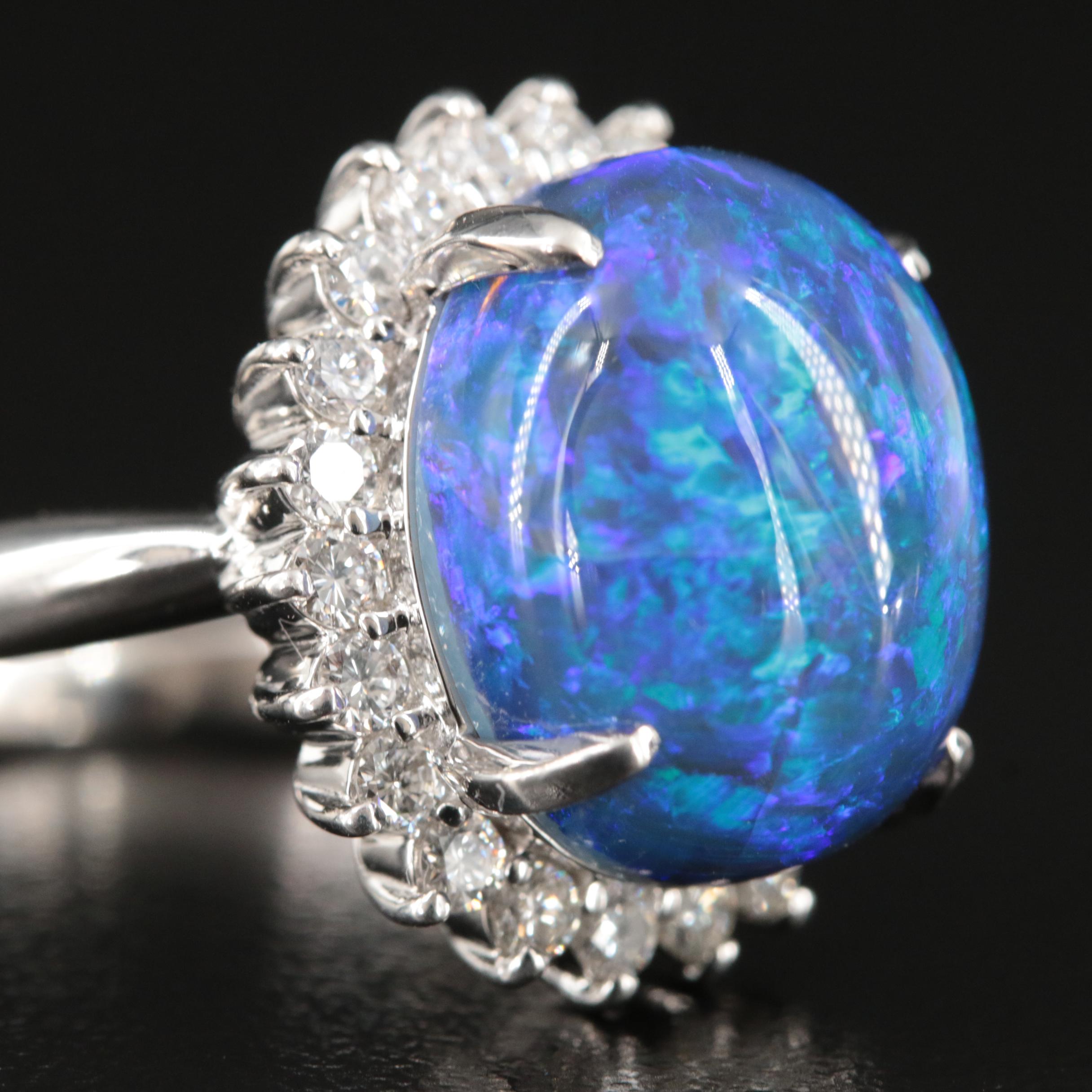 Platinum 10.16 CT Black Opal and Diamond Halo Ring