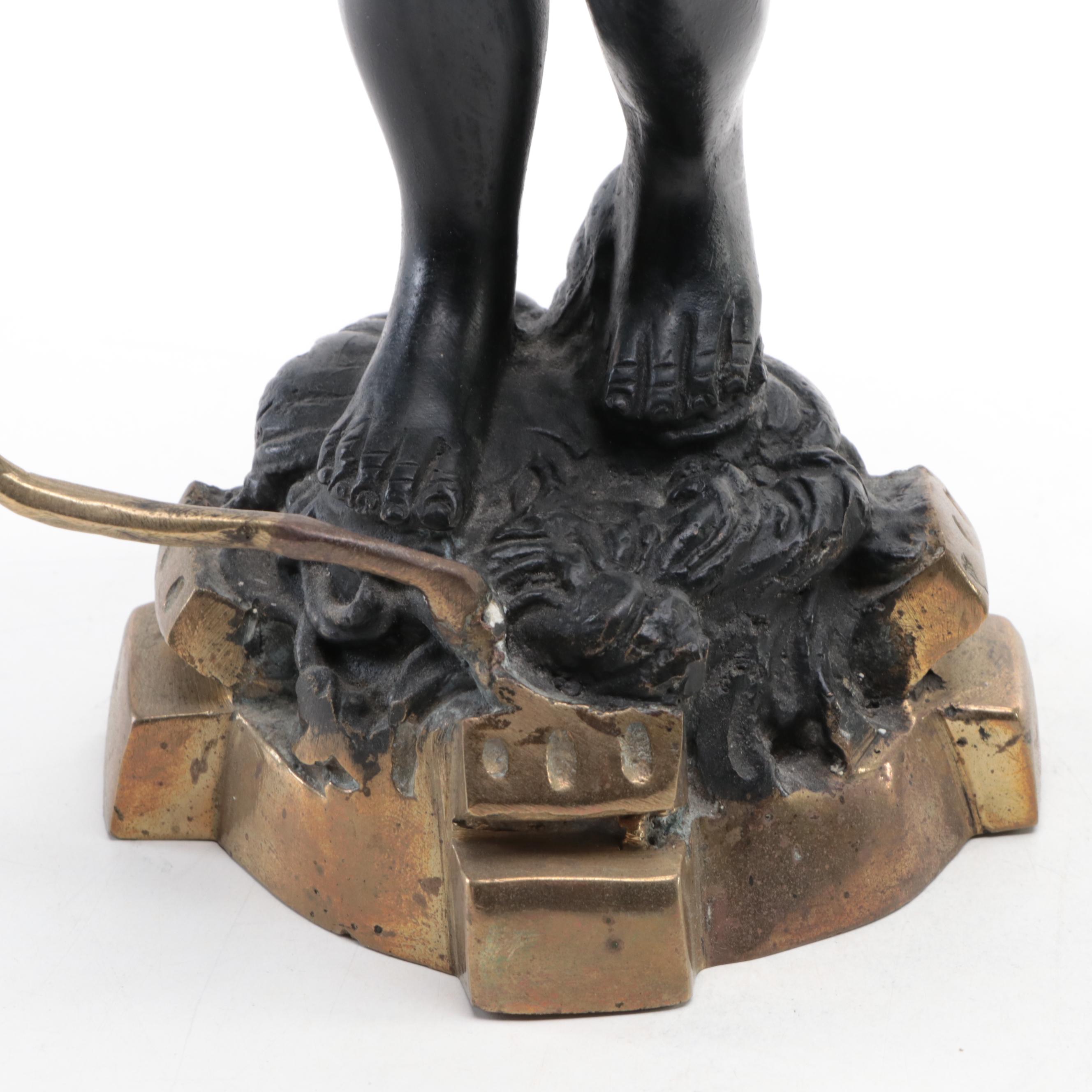 Pair of French Ebonized and Gilt Bronze Moor Figural Candle Holders