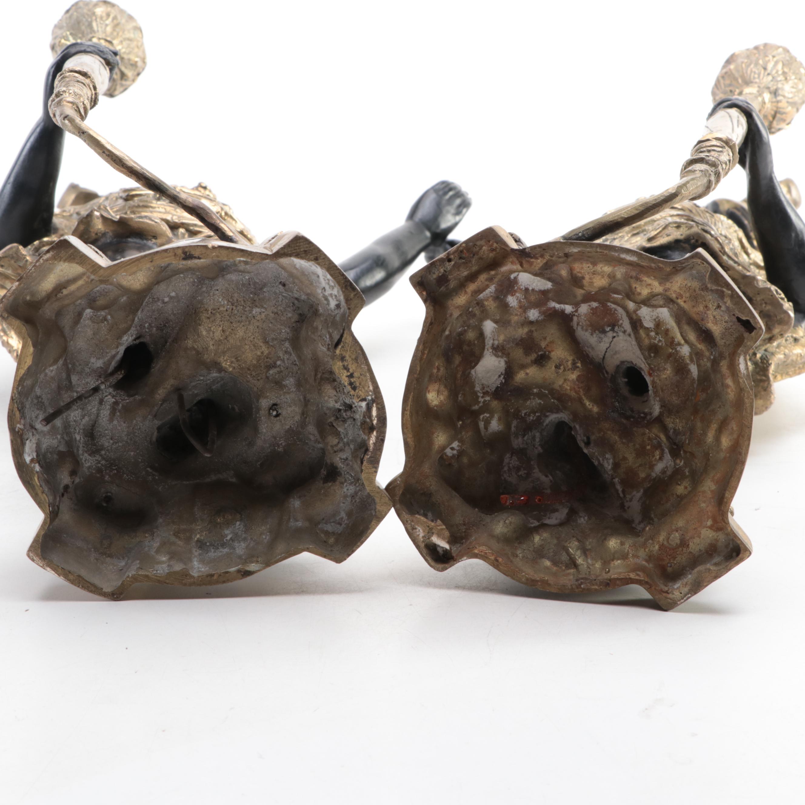 Pair of French Ebonized and Gilt Bronze Moor Figural Candle Holders
