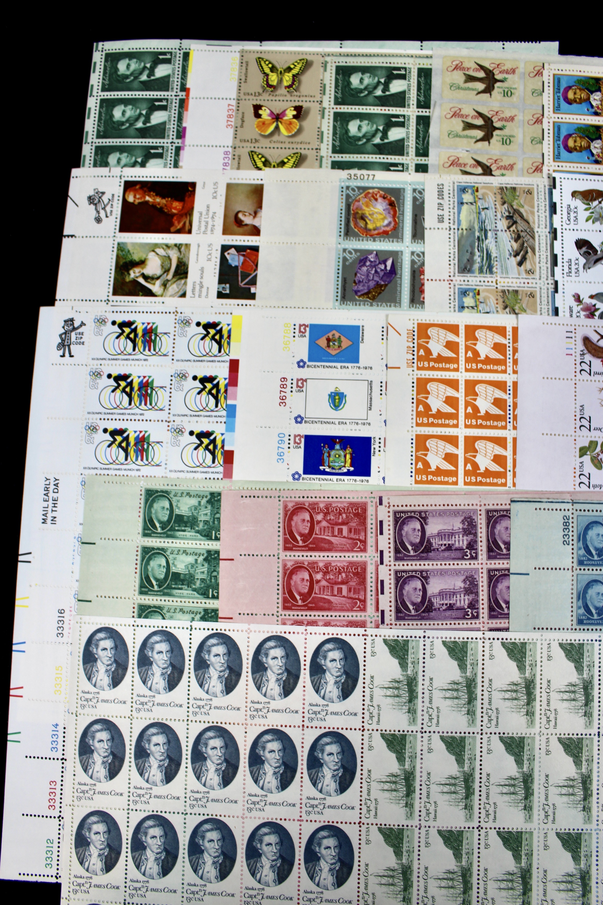 Twenty-Two Various Denominations of U.S. Postage Stamp Sheets