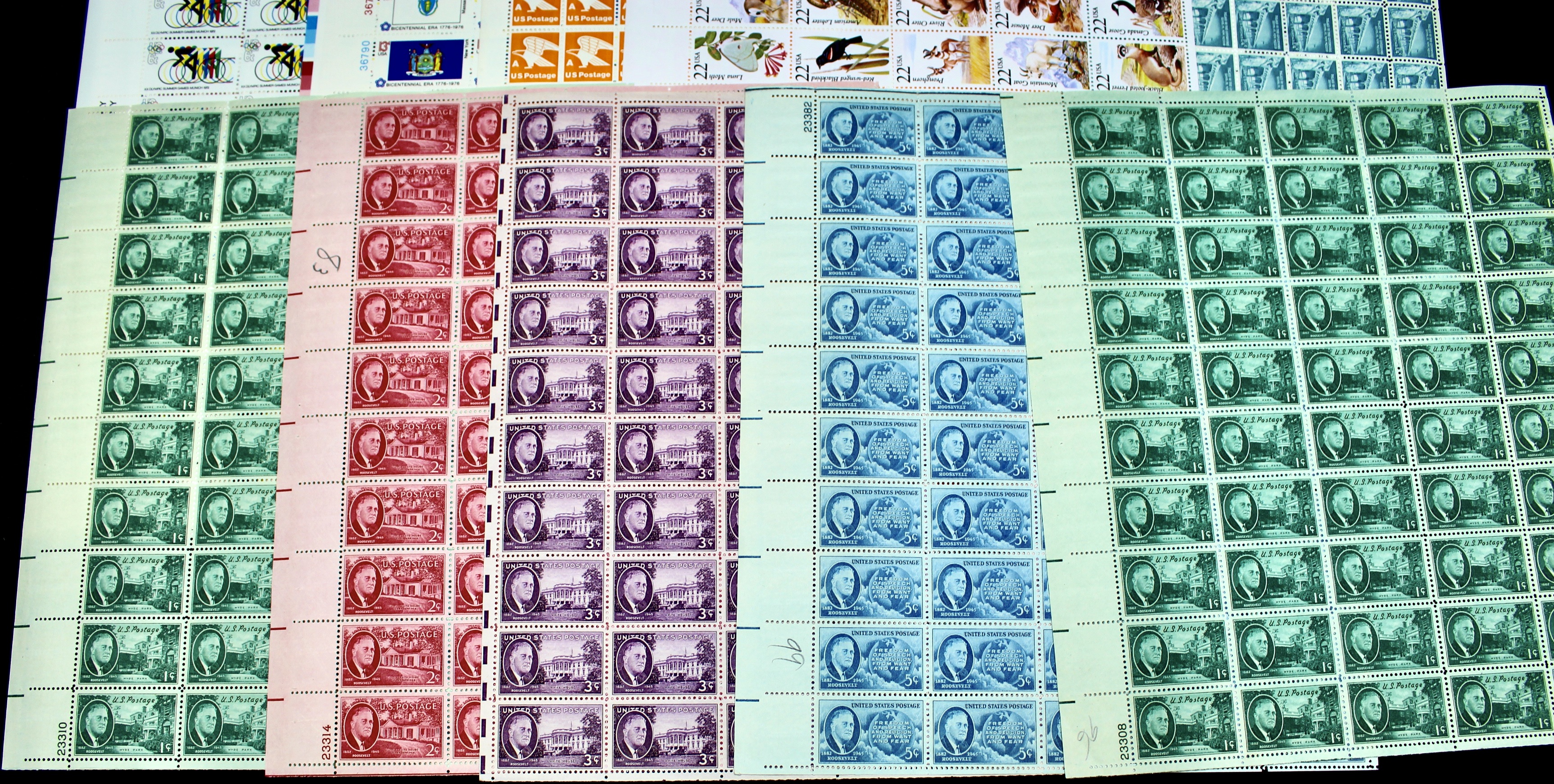 Twenty-Two Various Denominations of U.S. Postage Stamp Sheets