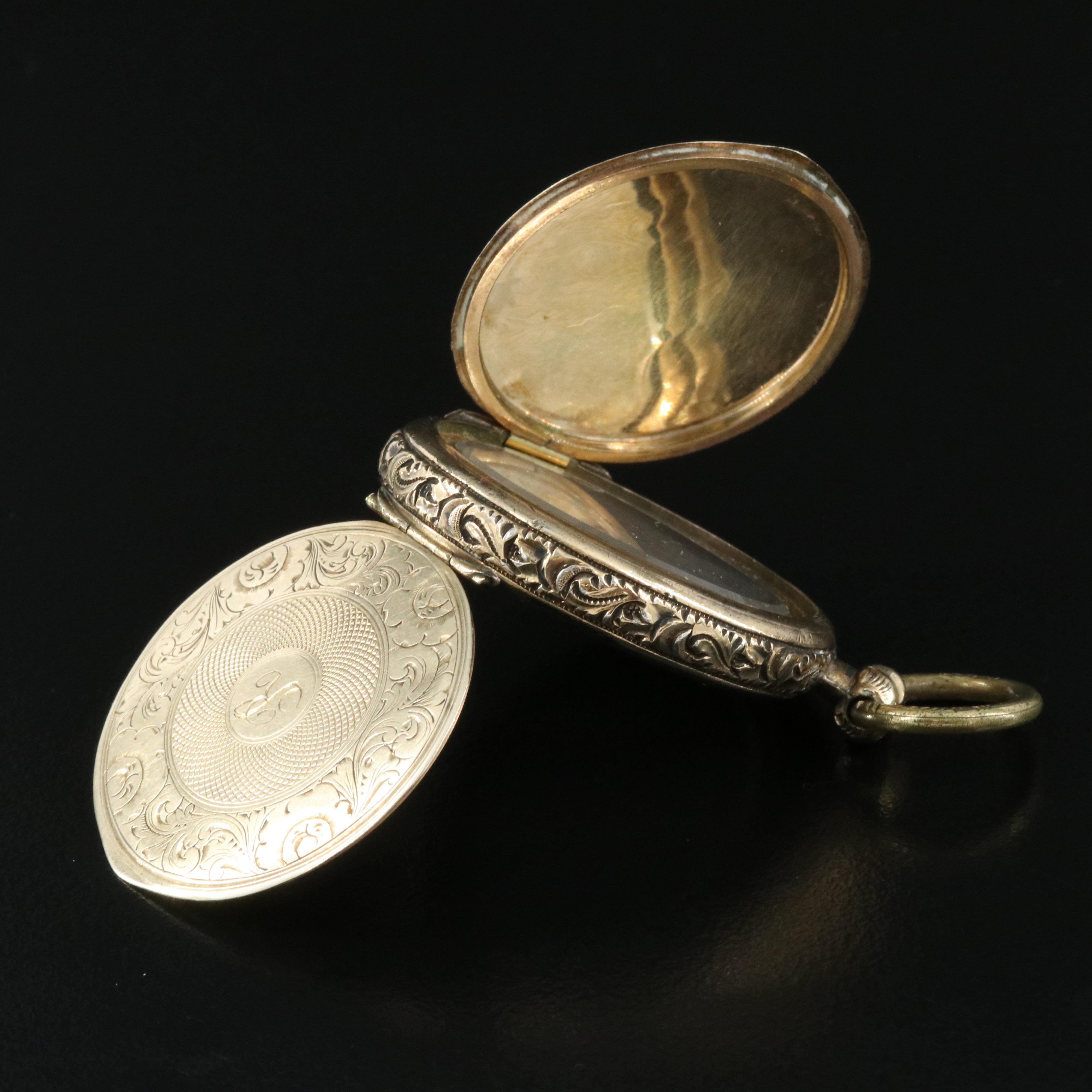 Antique Locket with Deguerreotypes