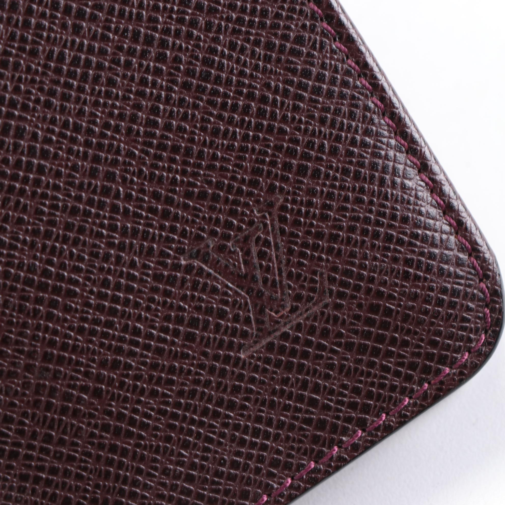 Louis Vuitton Kourad Clutch in Bordeaux Taïga Leather