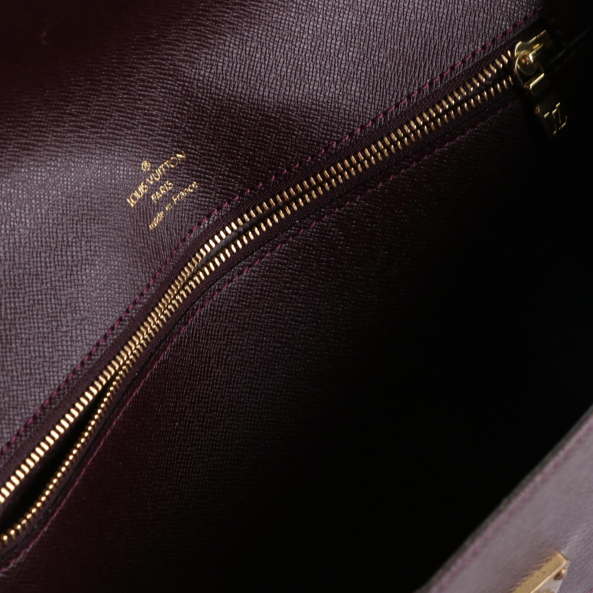 Louis Vuitton Kourad Clutch in Bordeaux Taïga Leather