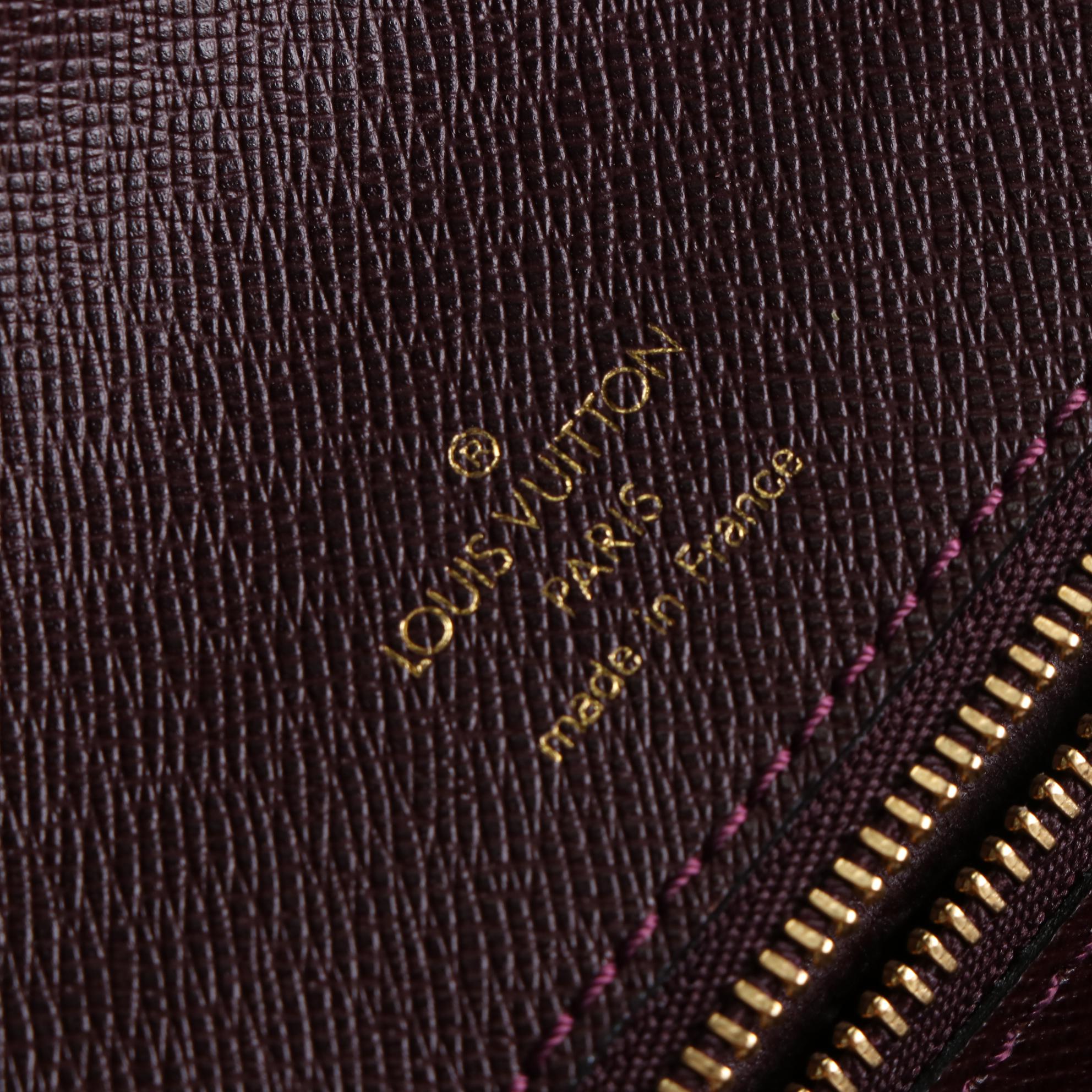 Louis Vuitton Kourad Clutch in Bordeaux Taïga Leather