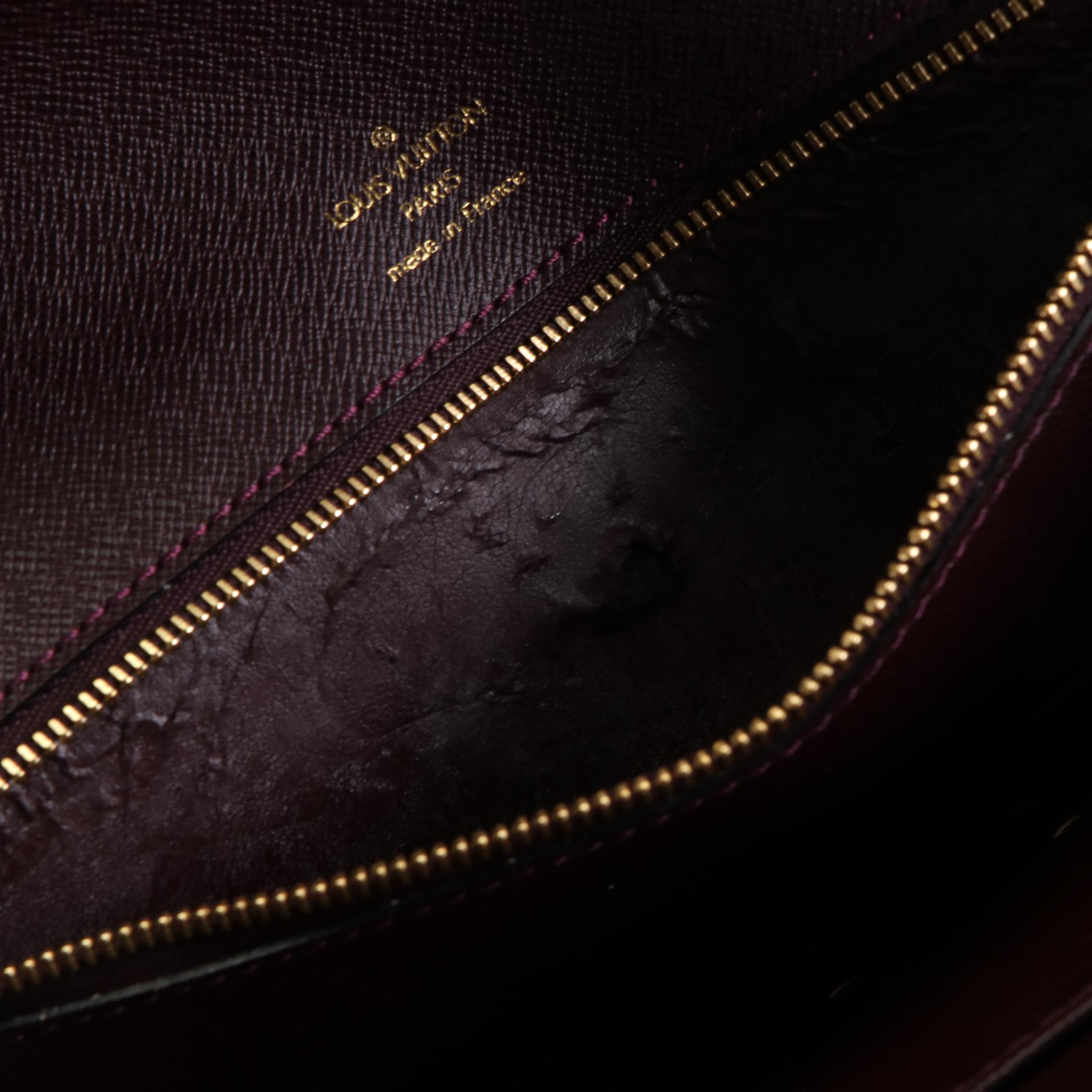 Louis Vuitton Kourad Clutch in Bordeaux Taïga Leather