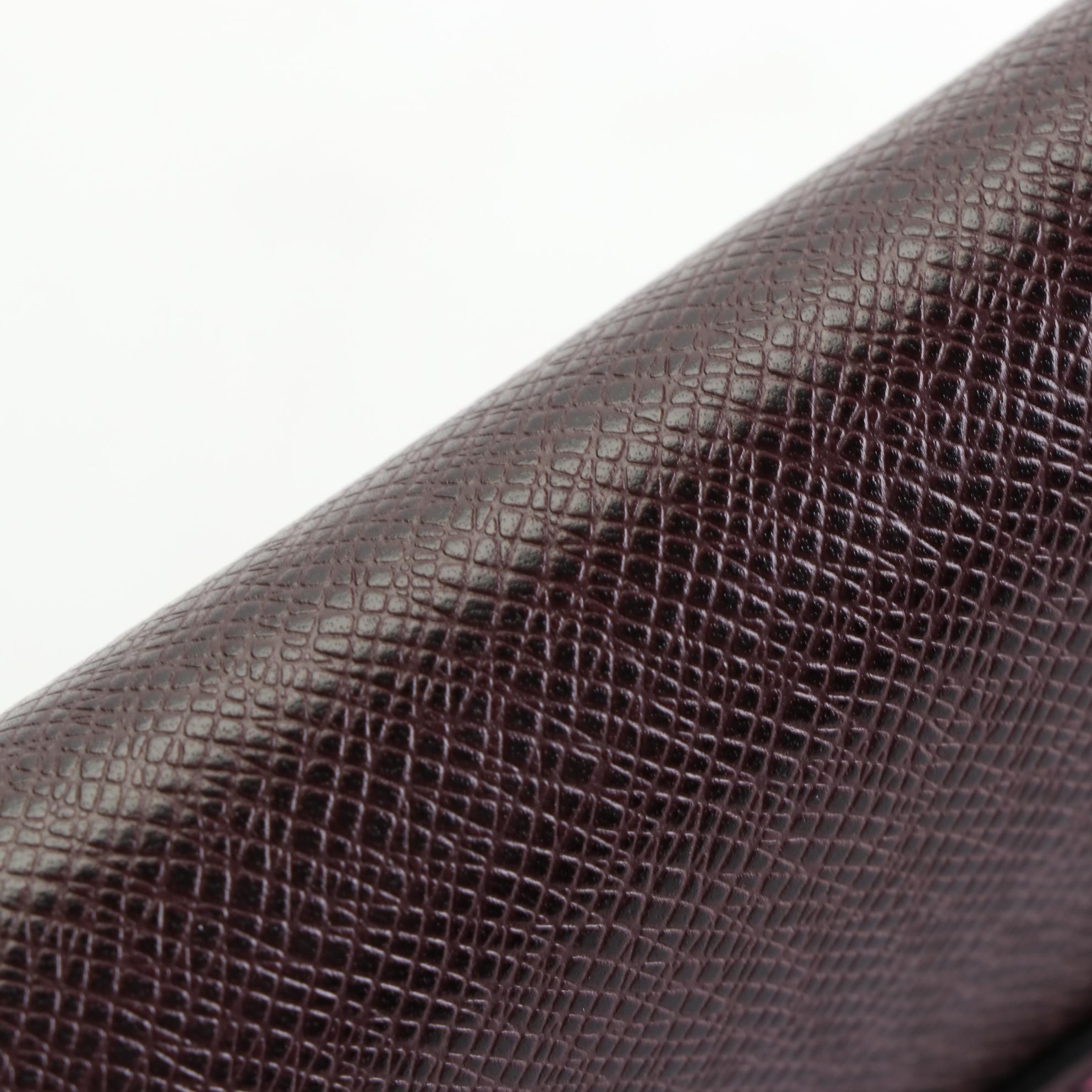 Louis Vuitton Kourad Clutch in Bordeaux Taïga Leather