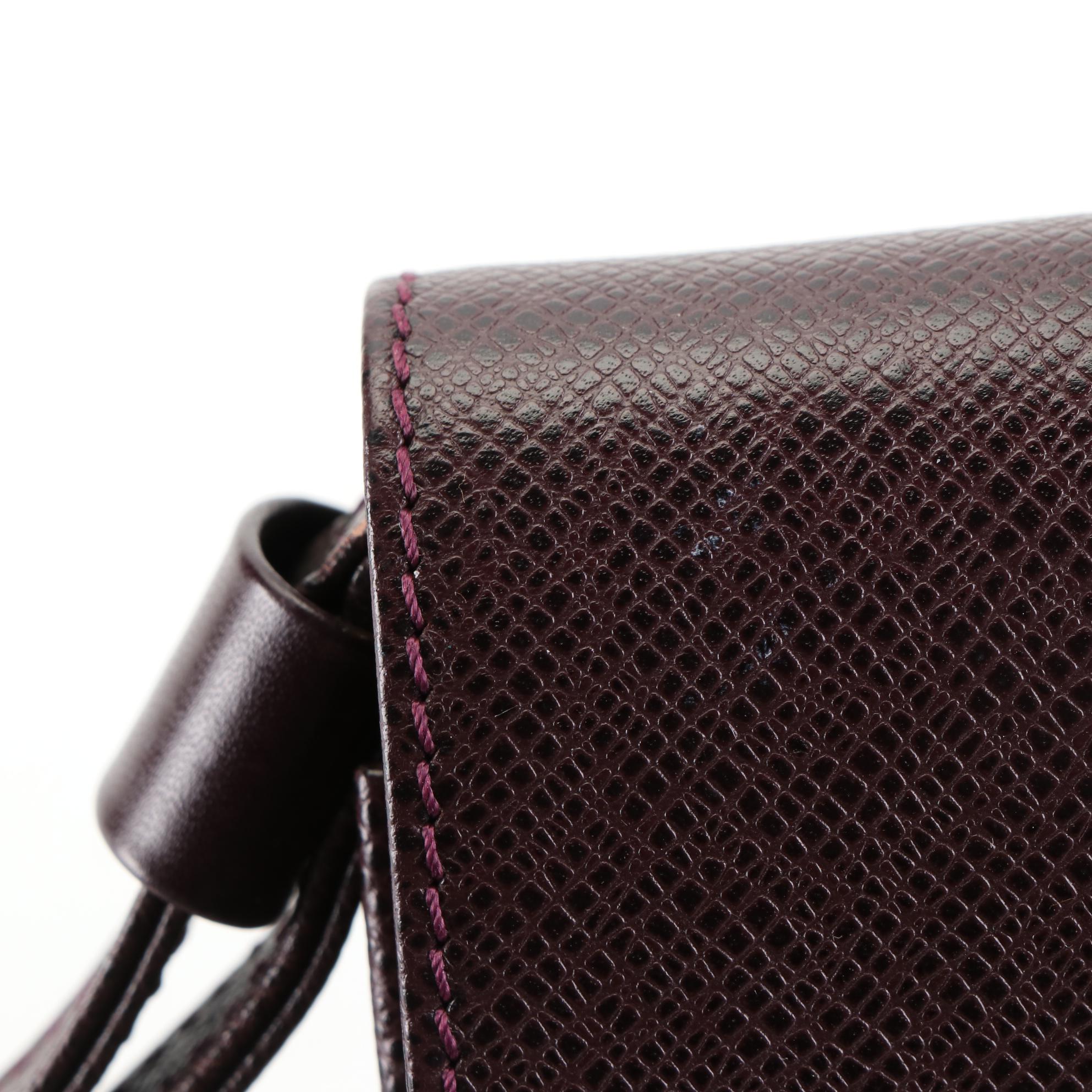 Louis Vuitton Kourad Clutch in Bordeaux Taïga Leather
