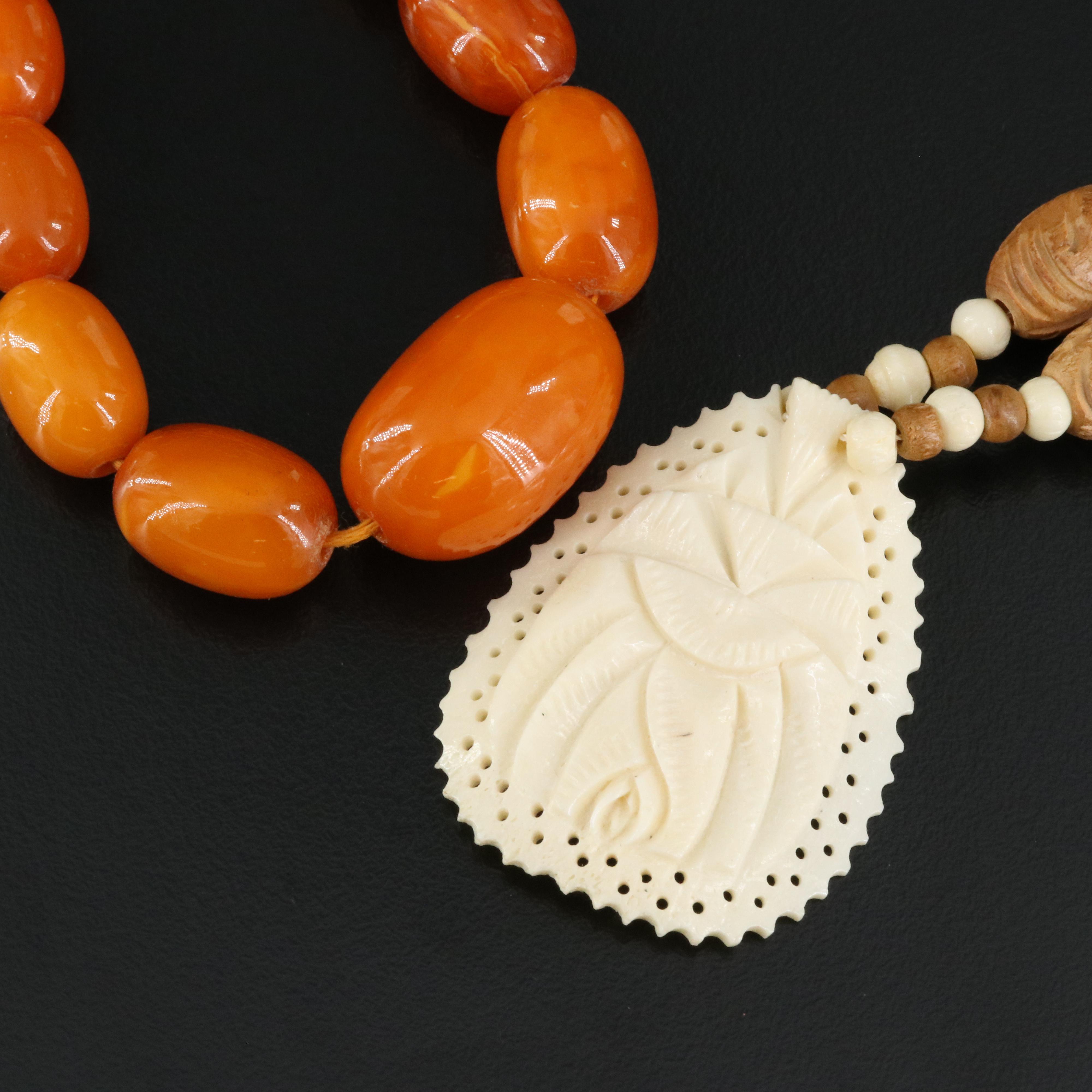 Graduated Amber, Carved Wood and Bone Necklaces with Sterling Clasps