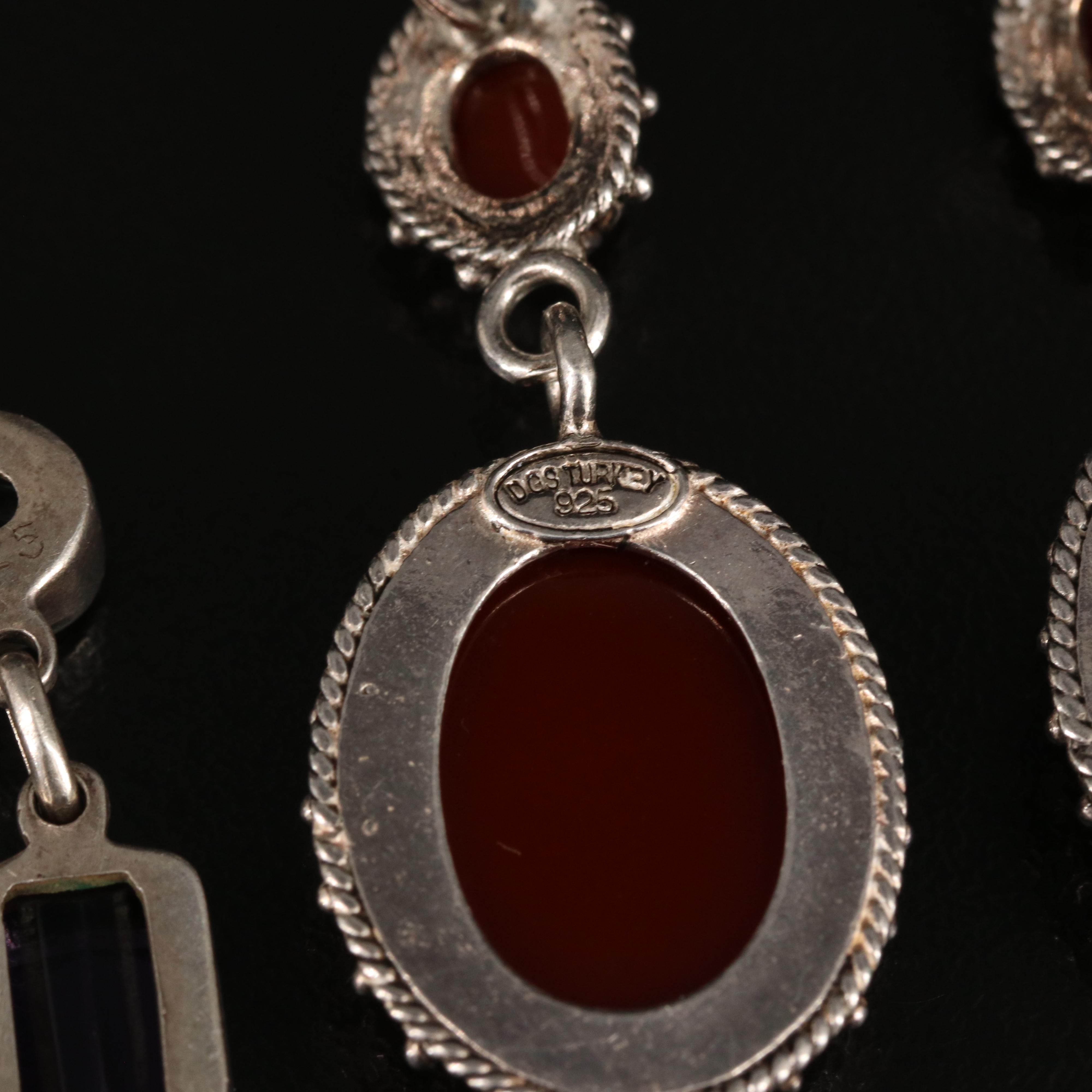 Swiss Blue Topaz and Amethyst Featured in Sterling Earring Collection