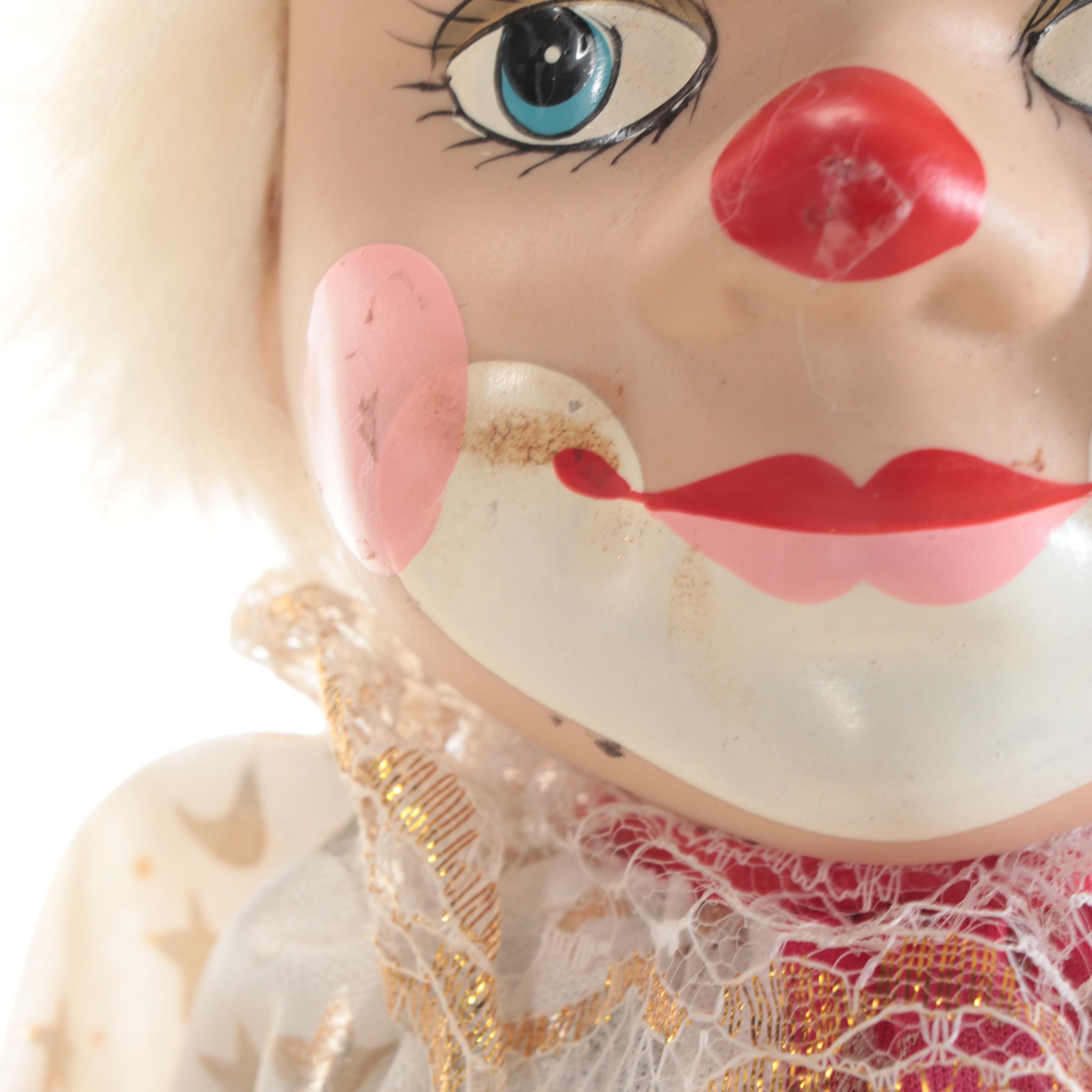 Hand-Painted Porcelain and Cloth Clown Dolls on Swings