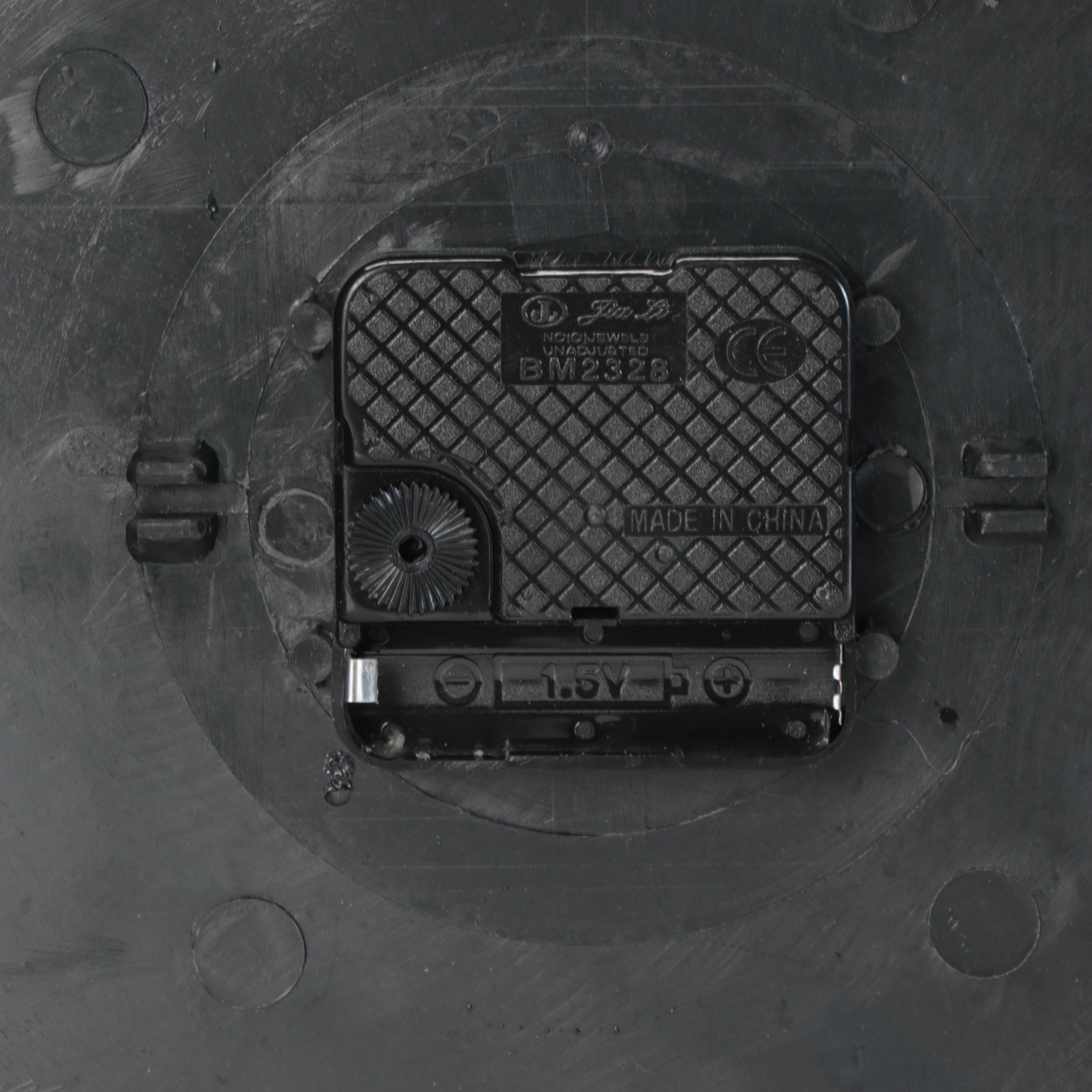 Contemporary Hanging Clock With Scrolled Metal and Sun Shaped Wall Accents