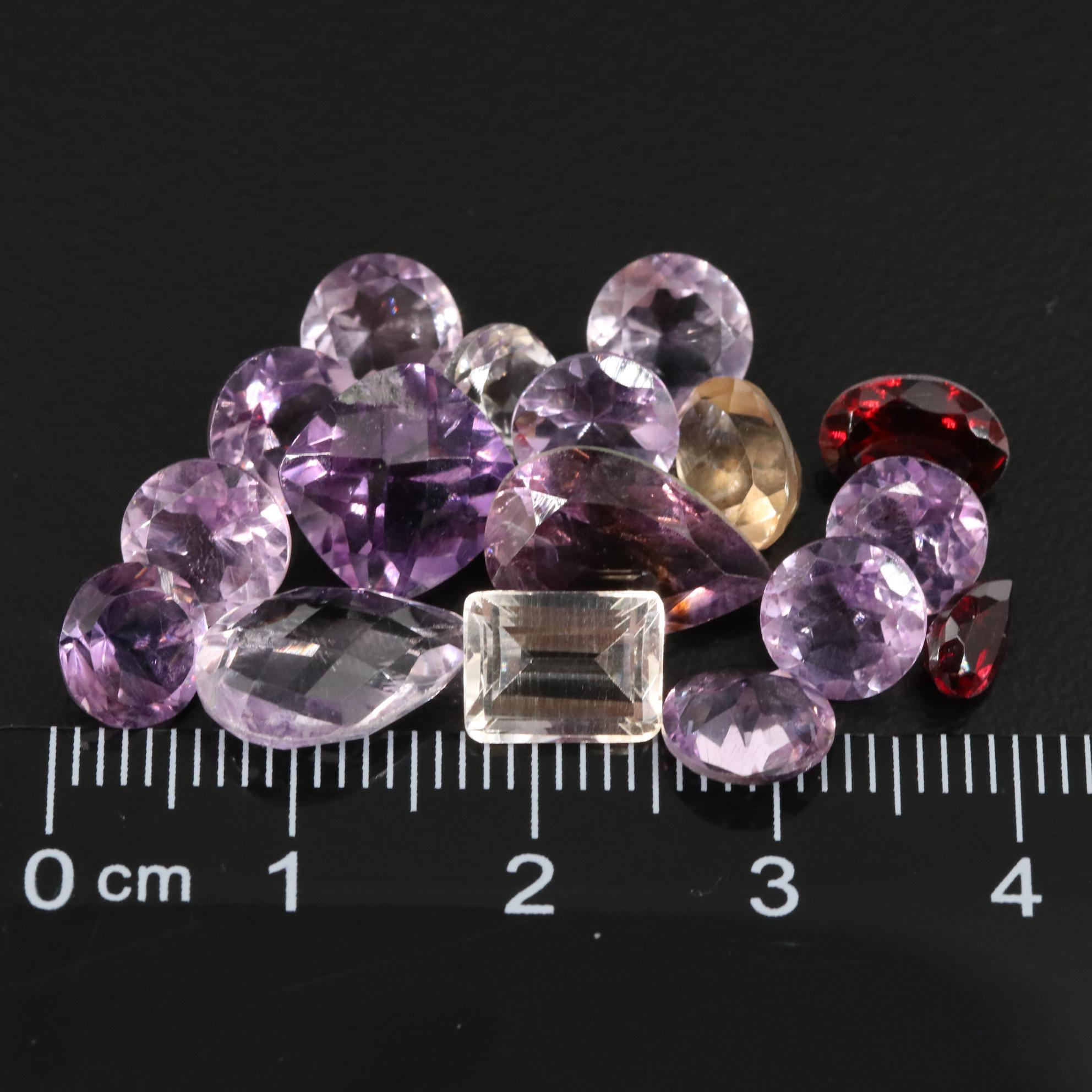 Loose 24.60 CTW Amethyst, Garnet, and Citrine Lot