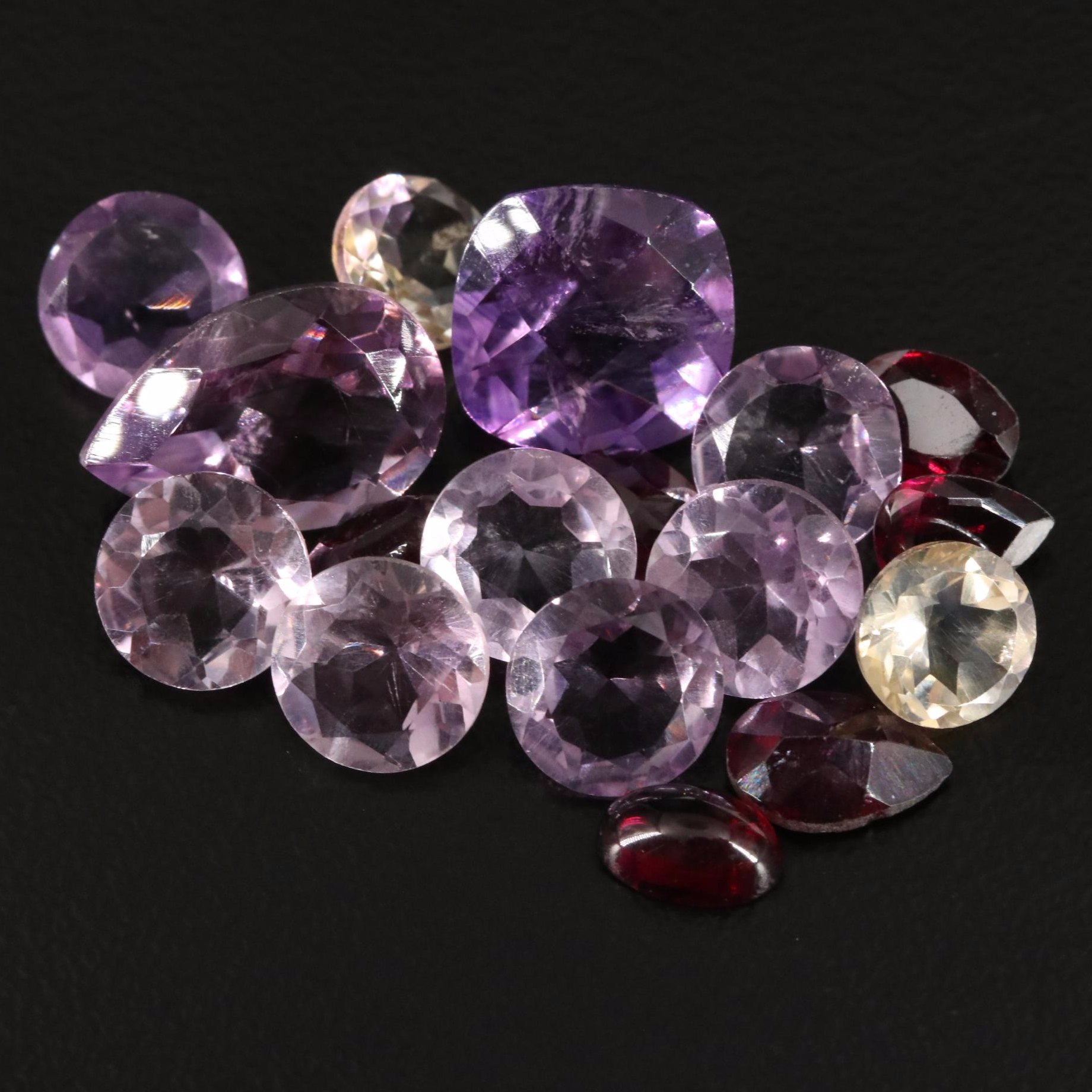 Loose 18.67 CTW Amethyst, Garnet, and Citrine Lot