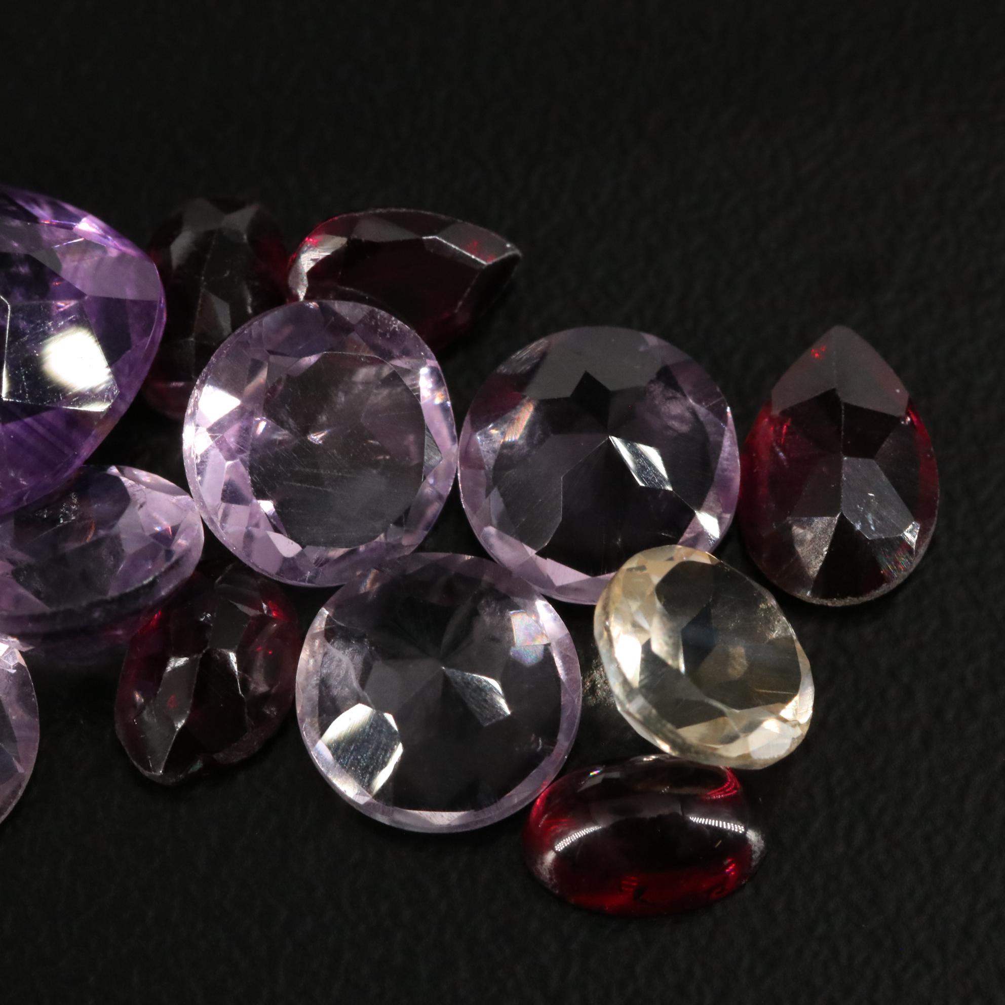 Loose 18.67 CTW Amethyst, Garnet, and Citrine Lot