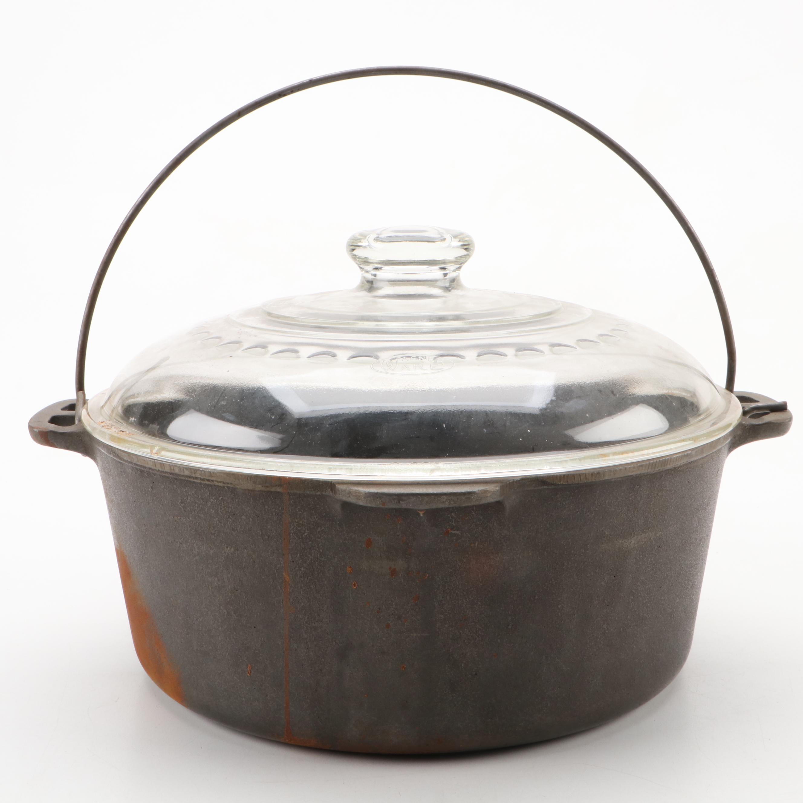 Griswold and Other Cast Iron Pans with Blue Bird Pie Pans and Other Kitchenware