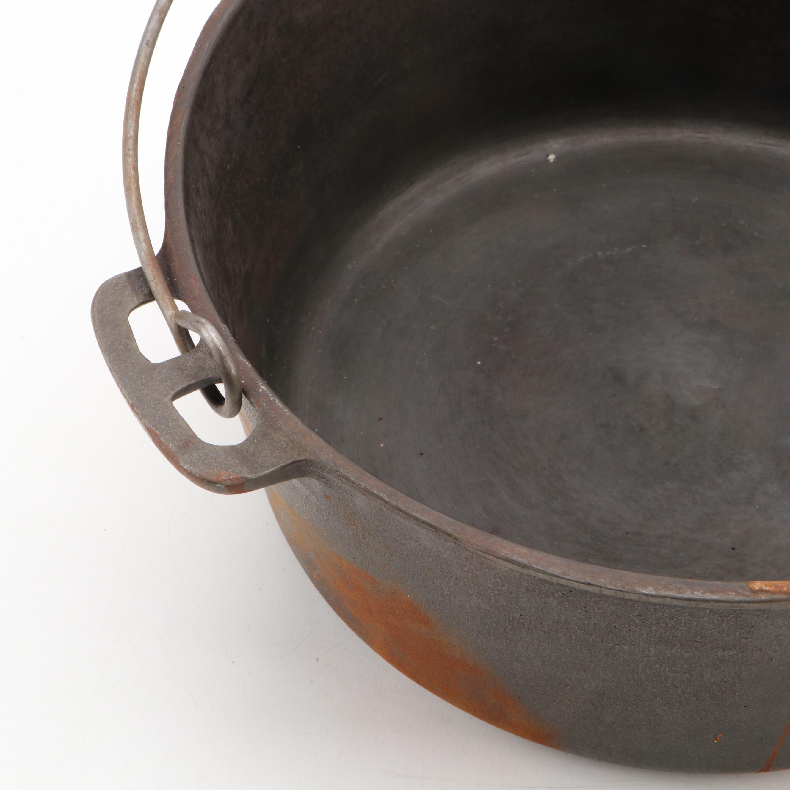 Griswold and Other Cast Iron Pans with Blue Bird Pie Pans and Other Kitchenware