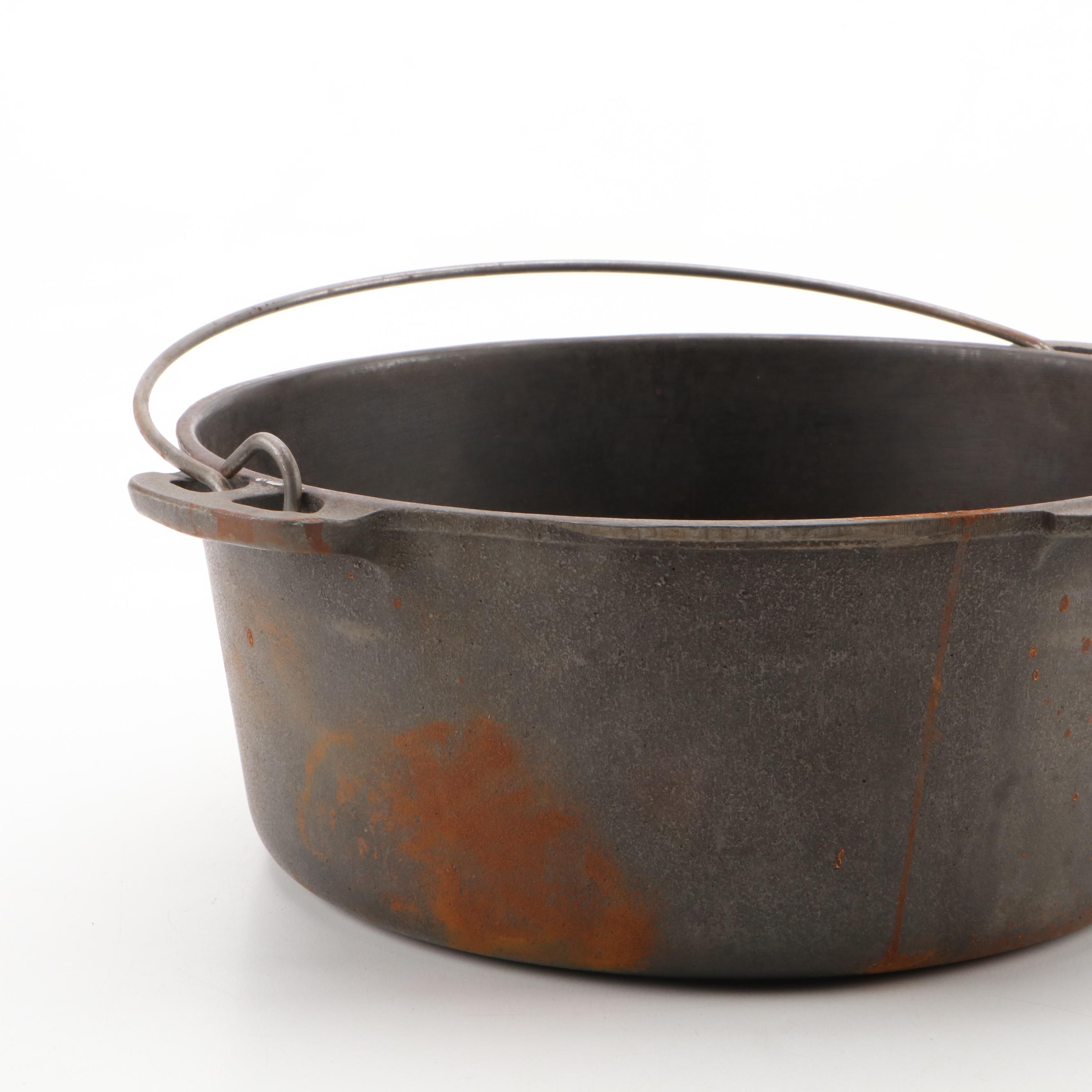 Griswold and Other Cast Iron Pans with Blue Bird Pie Pans and Other Kitchenware