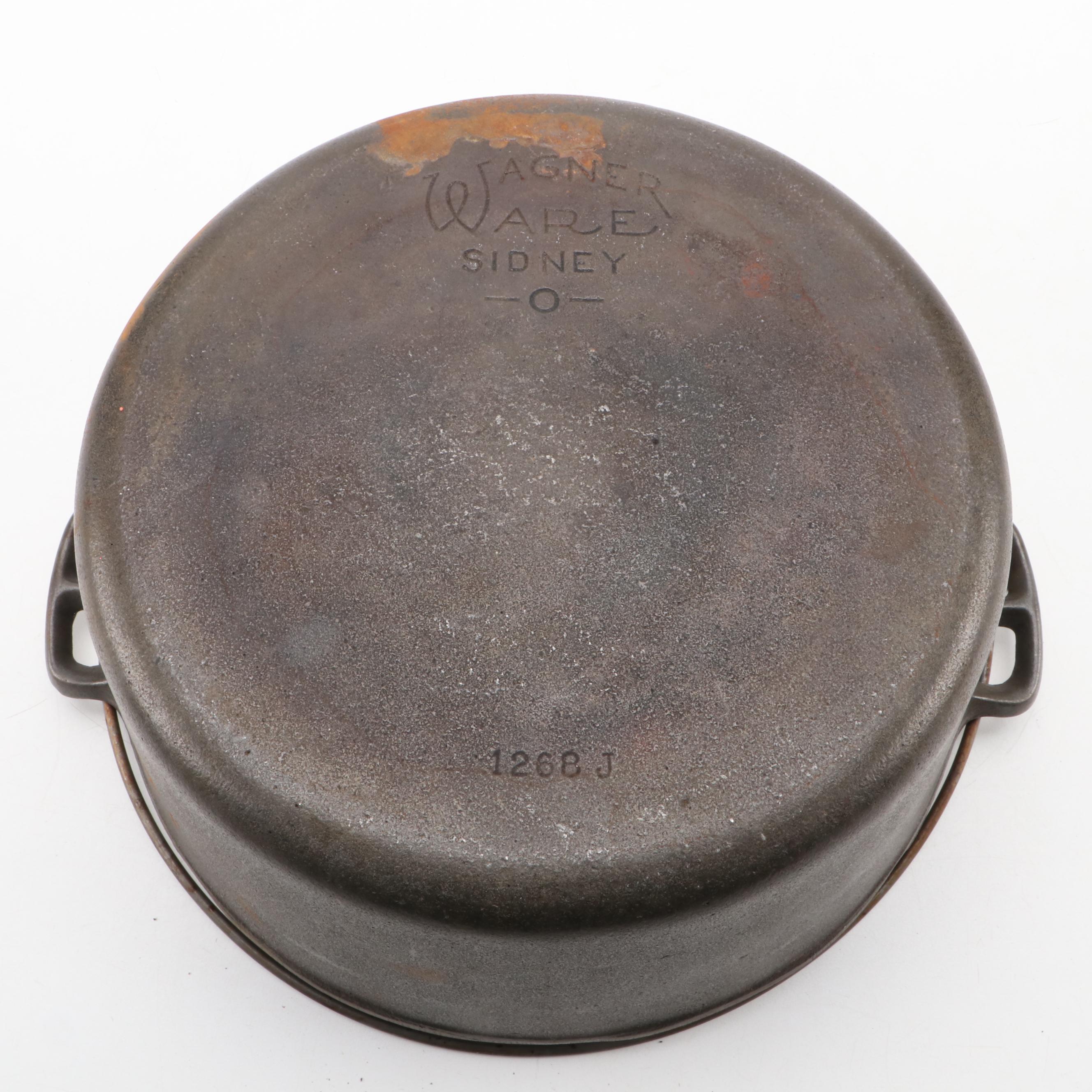 Griswold and Other Cast Iron Pans with Blue Bird Pie Pans and Other Kitchenware