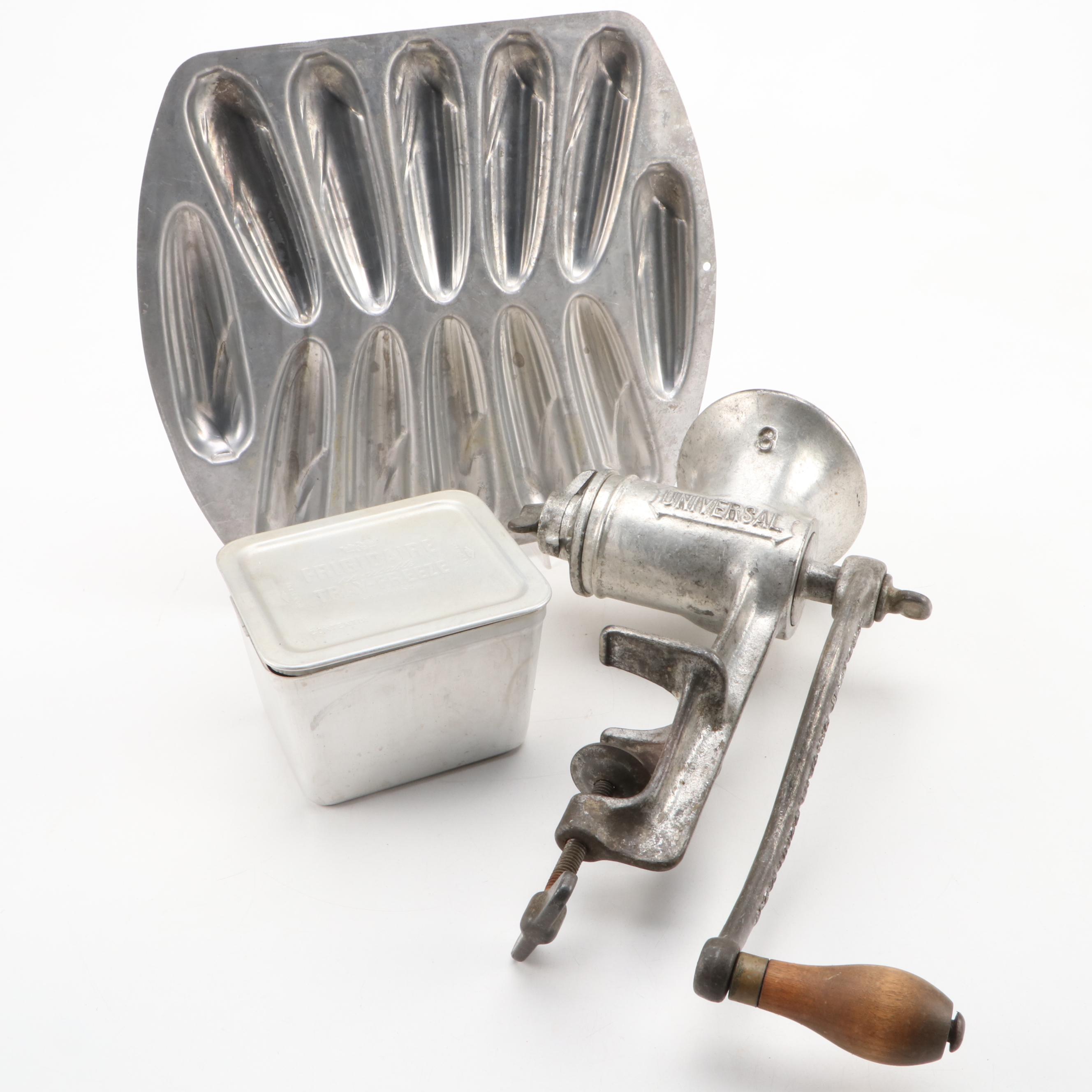 Griswold and Other Cast Iron Pans with Blue Bird Pie Pans and Other Kitchenware