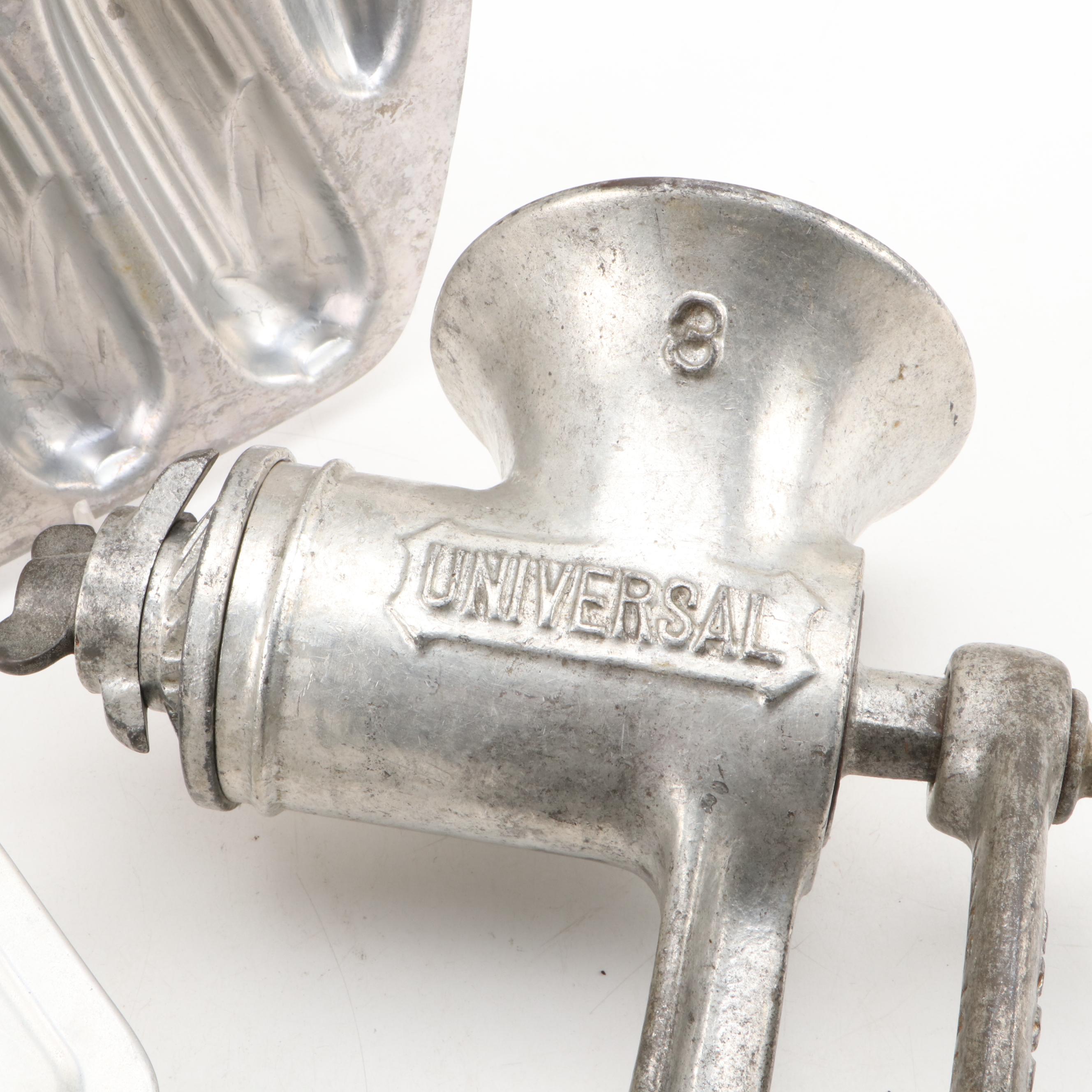 Griswold and Other Cast Iron Pans with Blue Bird Pie Pans and Other Kitchenware