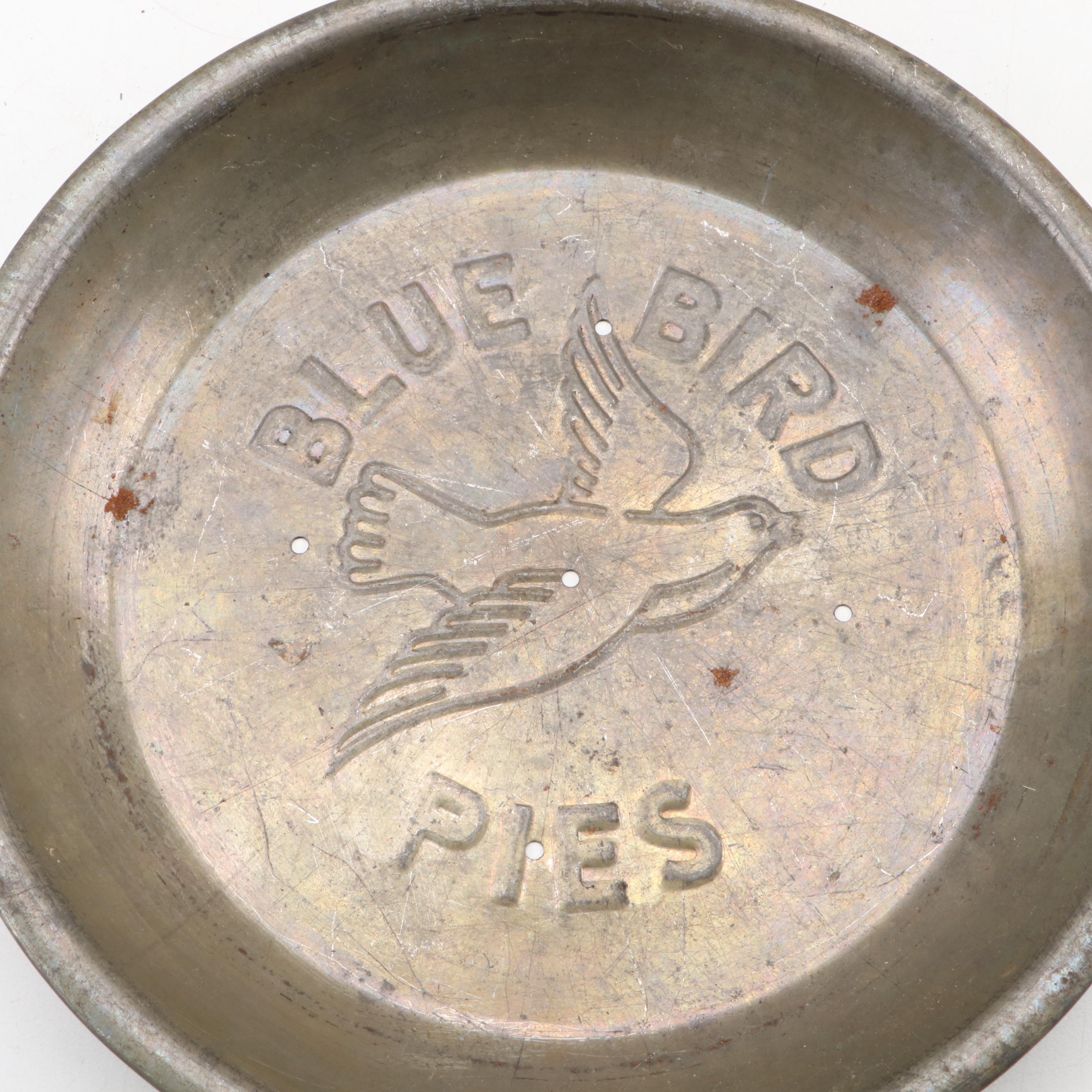 Griswold and Other Cast Iron Pans with Blue Bird Pie Pans and Other Kitchenware