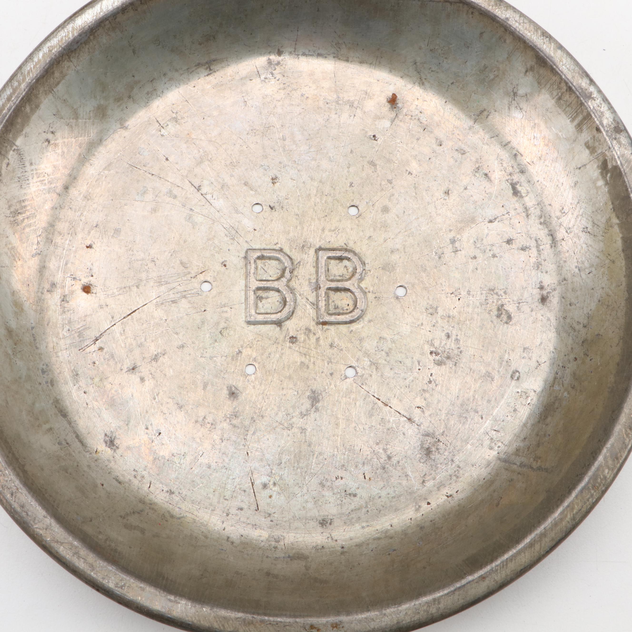 Griswold and Other Cast Iron Pans with Blue Bird Pie Pans and Other Kitchenware