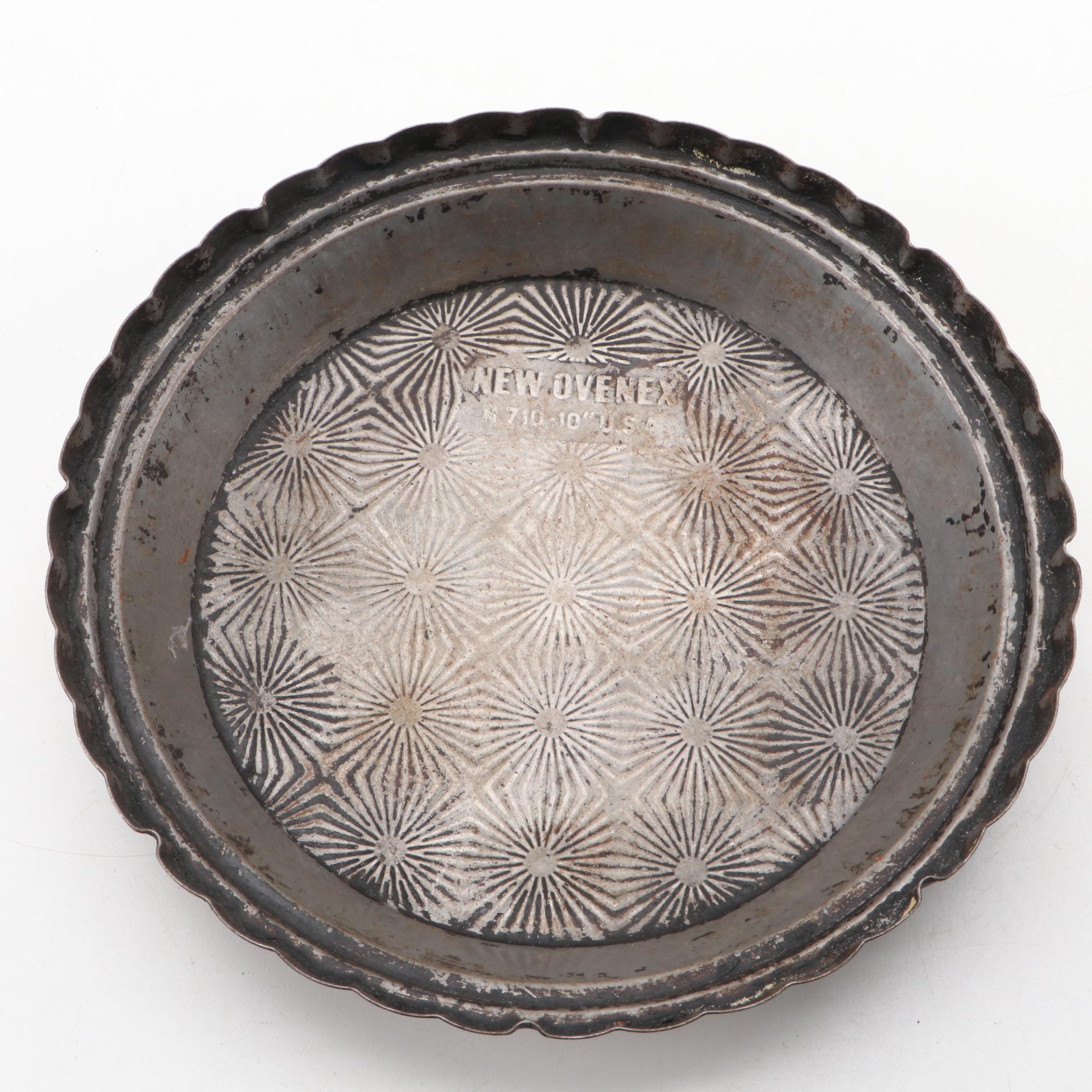 Griswold and Other Cast Iron Pans with Blue Bird Pie Pans and Other Kitchenware