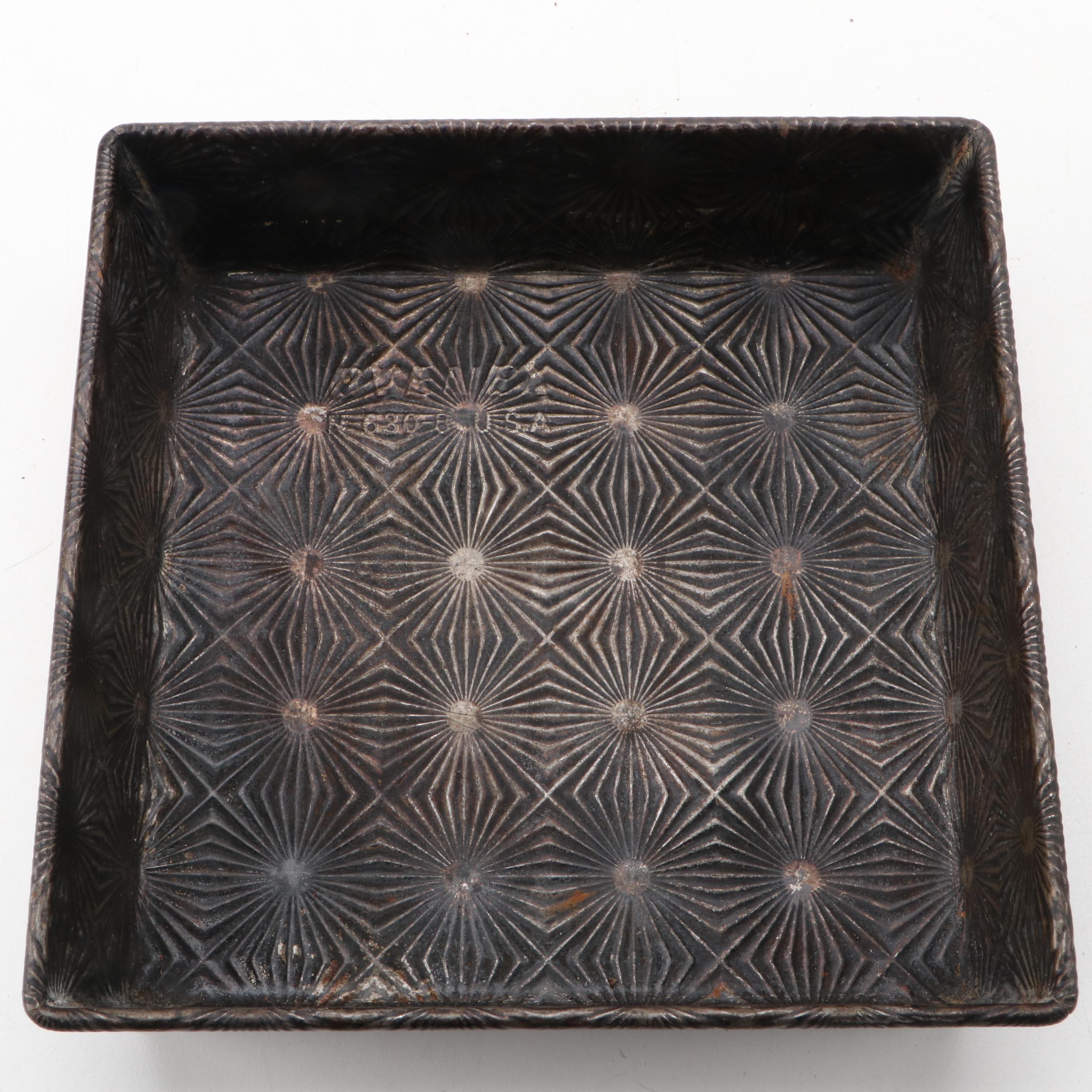 Griswold and Other Cast Iron Pans with Blue Bird Pie Pans and Other Kitchenware