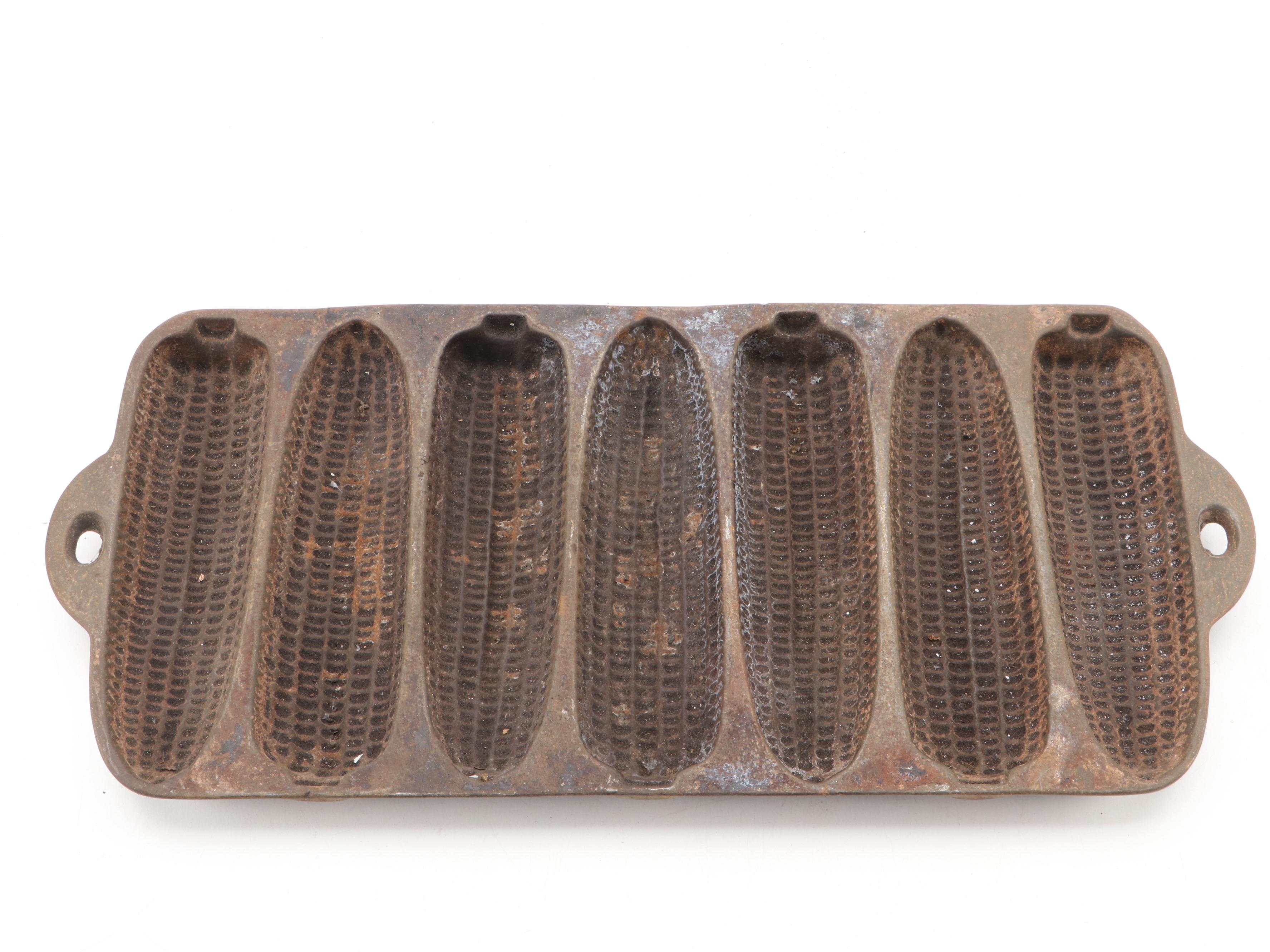 Griswold and Other Cast Iron Pans with Blue Bird Pie Pans and Other Kitchenware