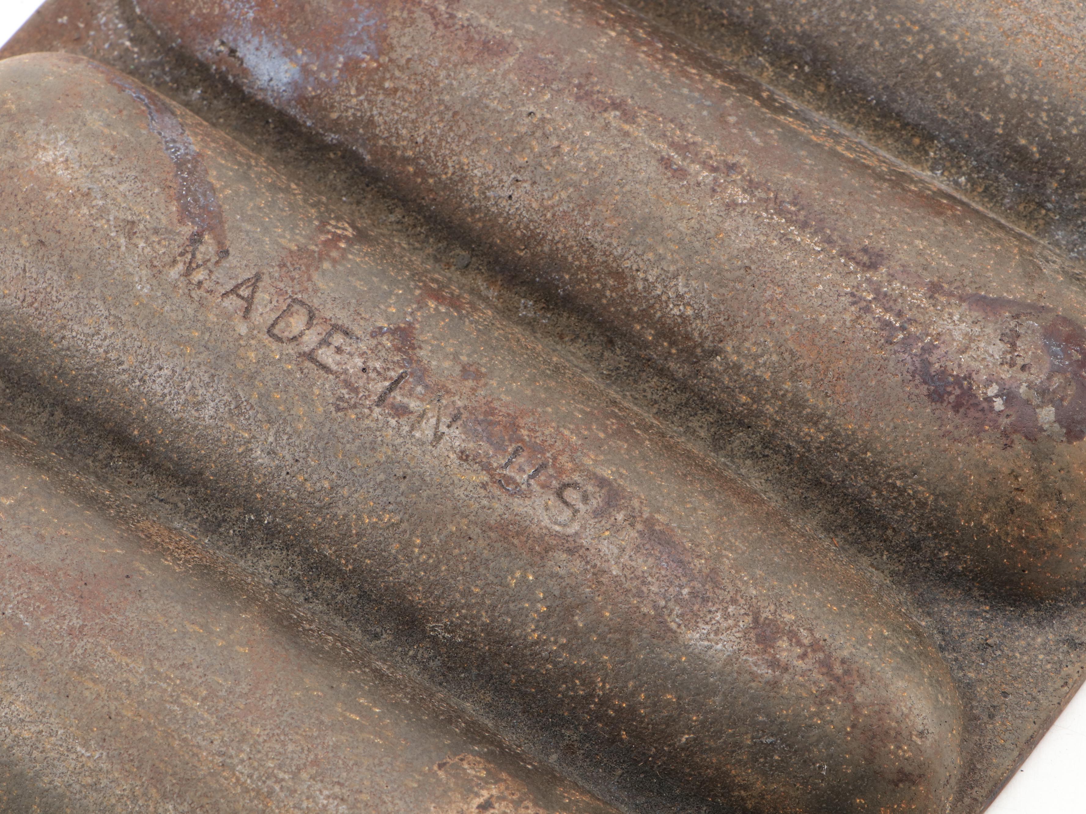 Griswold and Other Cast Iron Pans with Blue Bird Pie Pans and Other Kitchenware