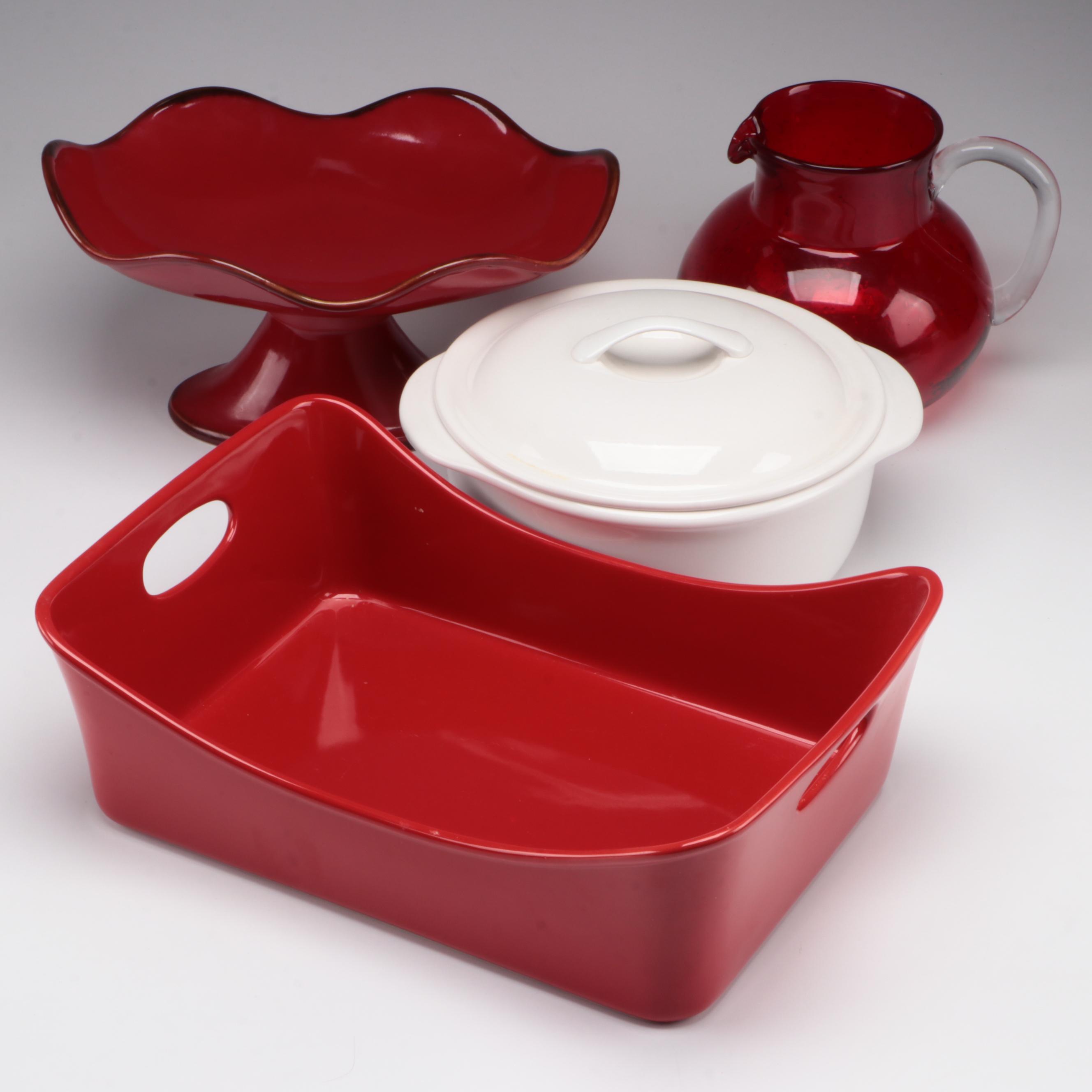 Red Glass Pitcher with Other Stoneware Dishes and Bowls