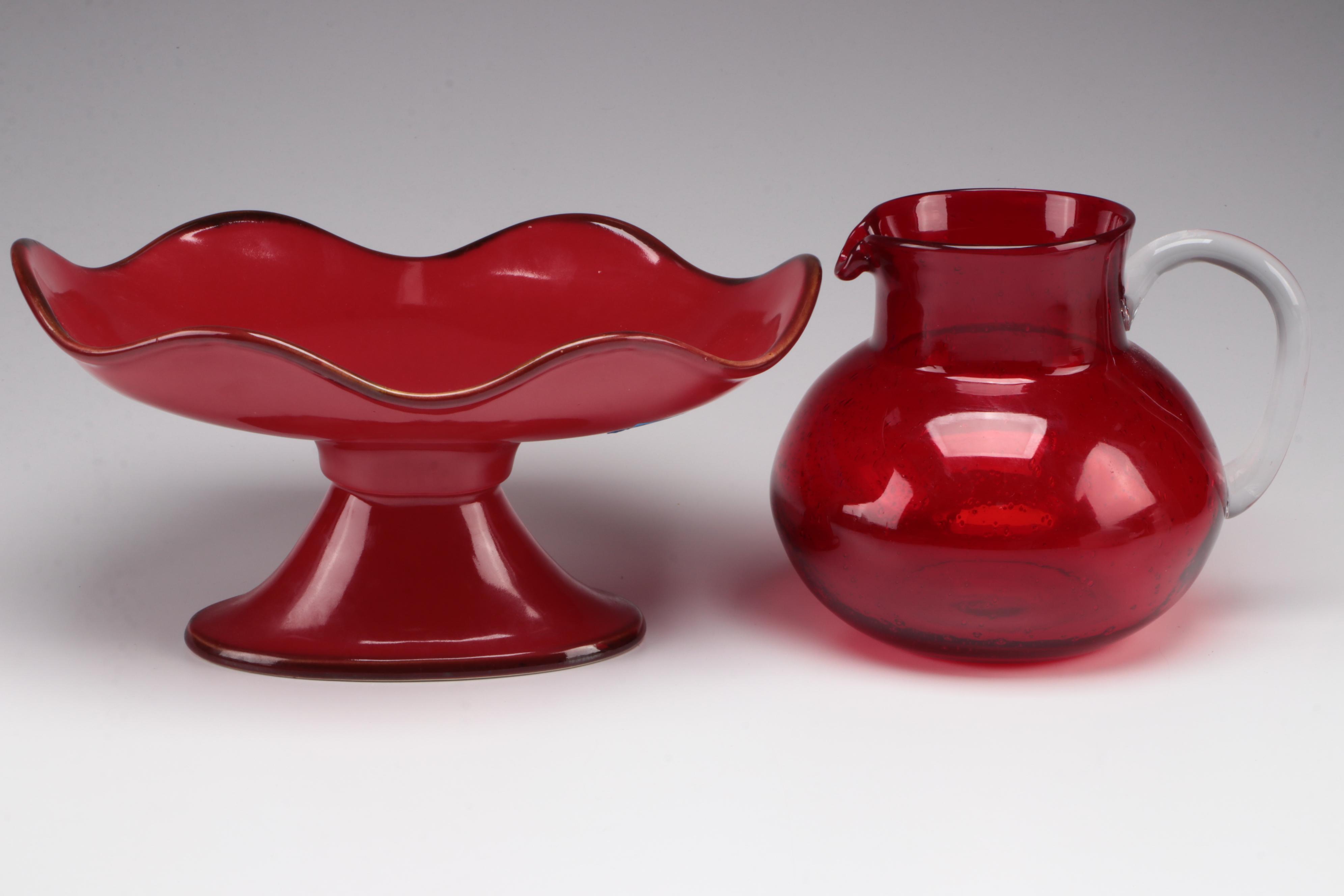 Red Glass Pitcher with Other Stoneware Dishes and Bowls