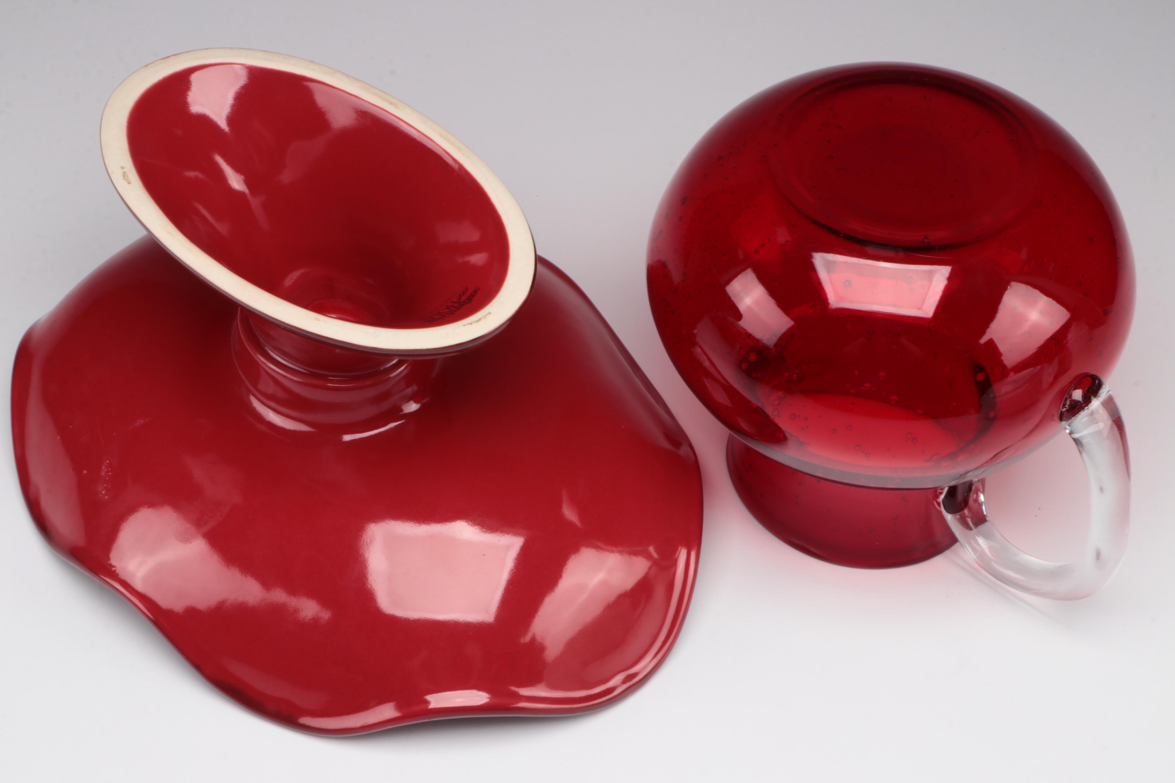 Red Glass Pitcher with Other Stoneware Dishes and Bowls