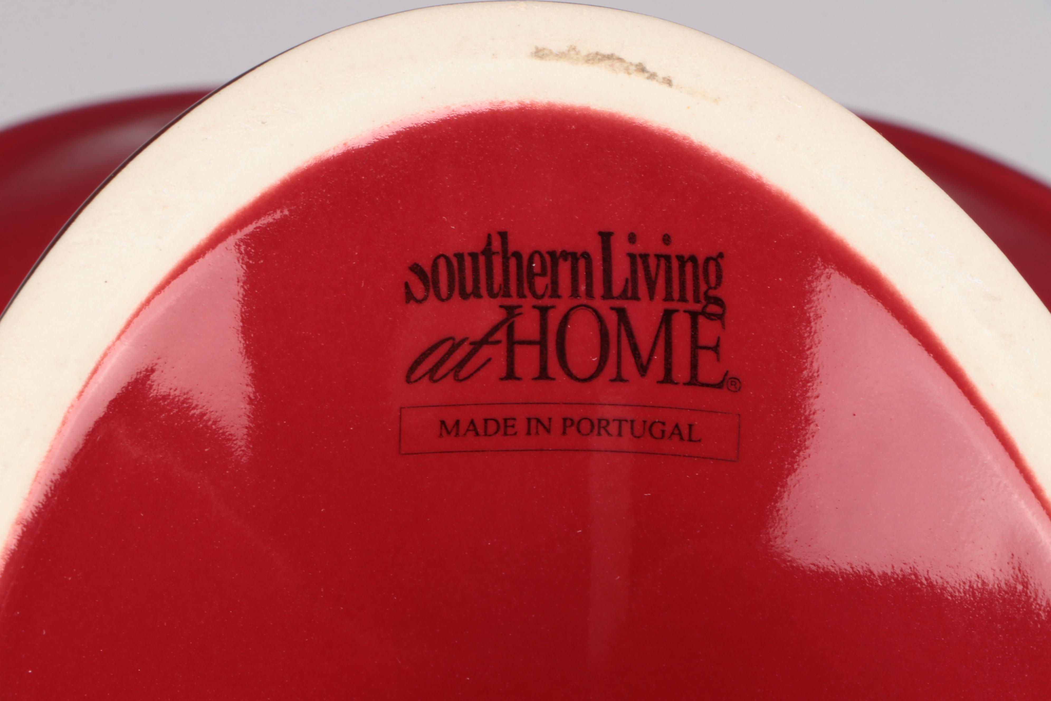 Red Glass Pitcher with Other Stoneware Dishes and Bowls