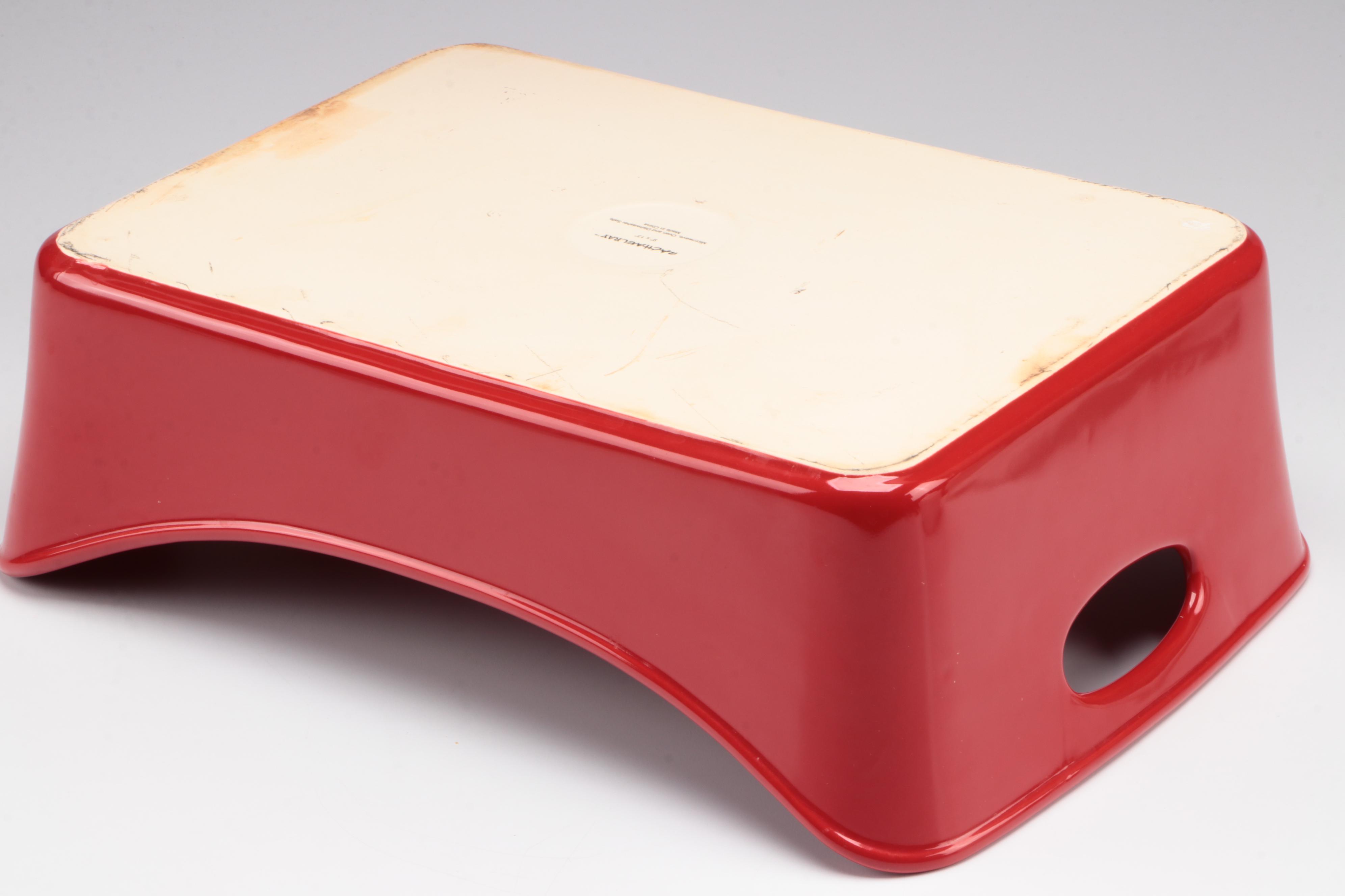 Red Glass Pitcher with Other Stoneware Dishes and Bowls