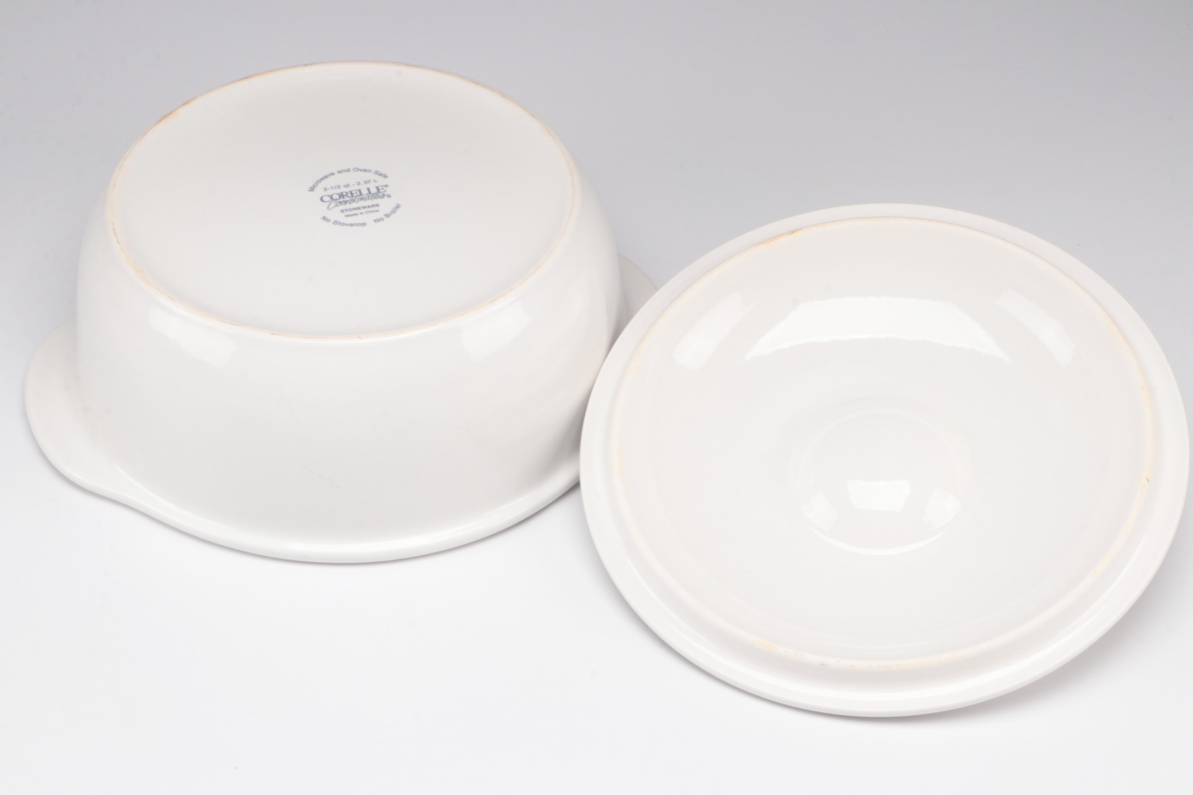 Red Glass Pitcher with Other Stoneware Dishes and Bowls