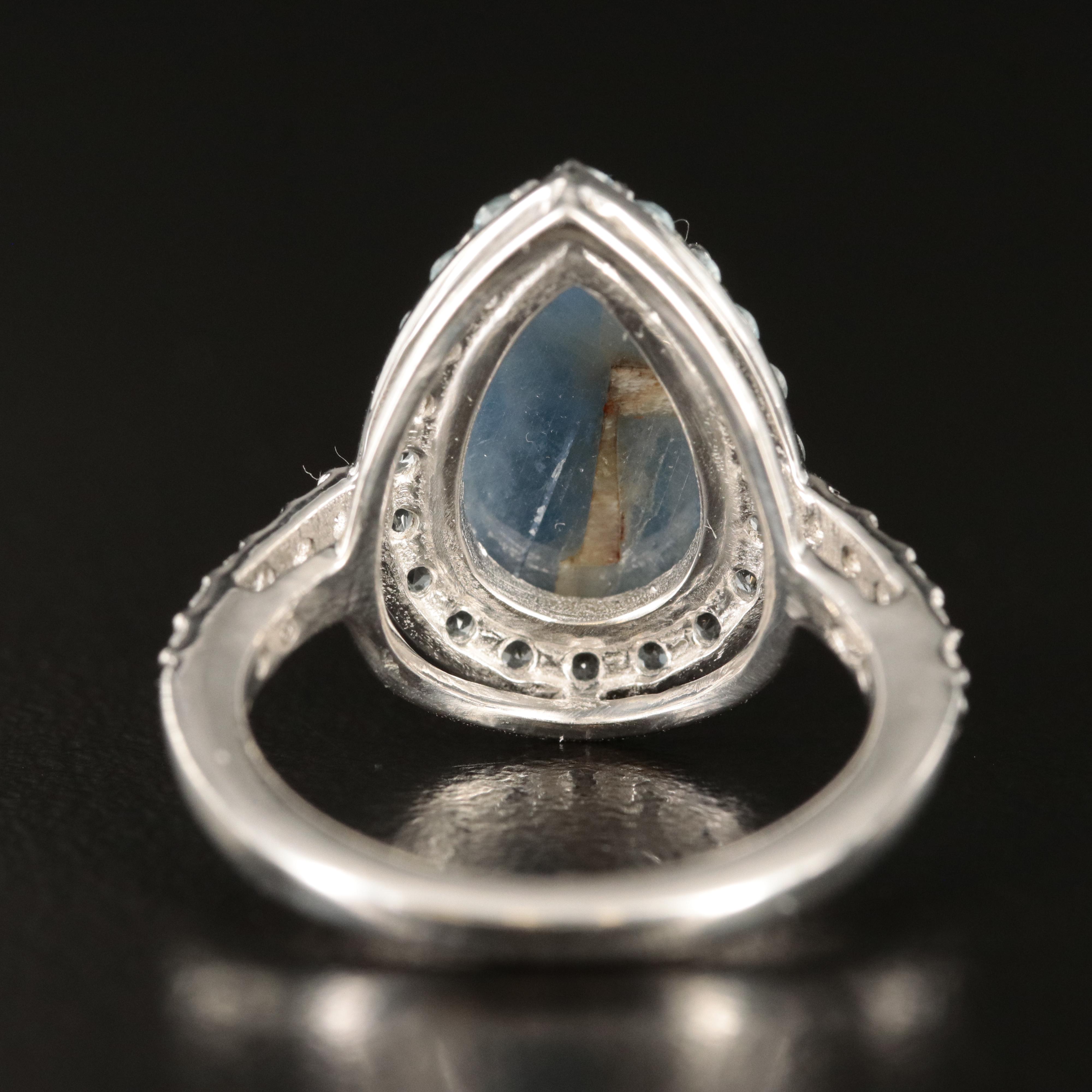 Sterling Sapphire and Topaz Teardrop Halo Ring