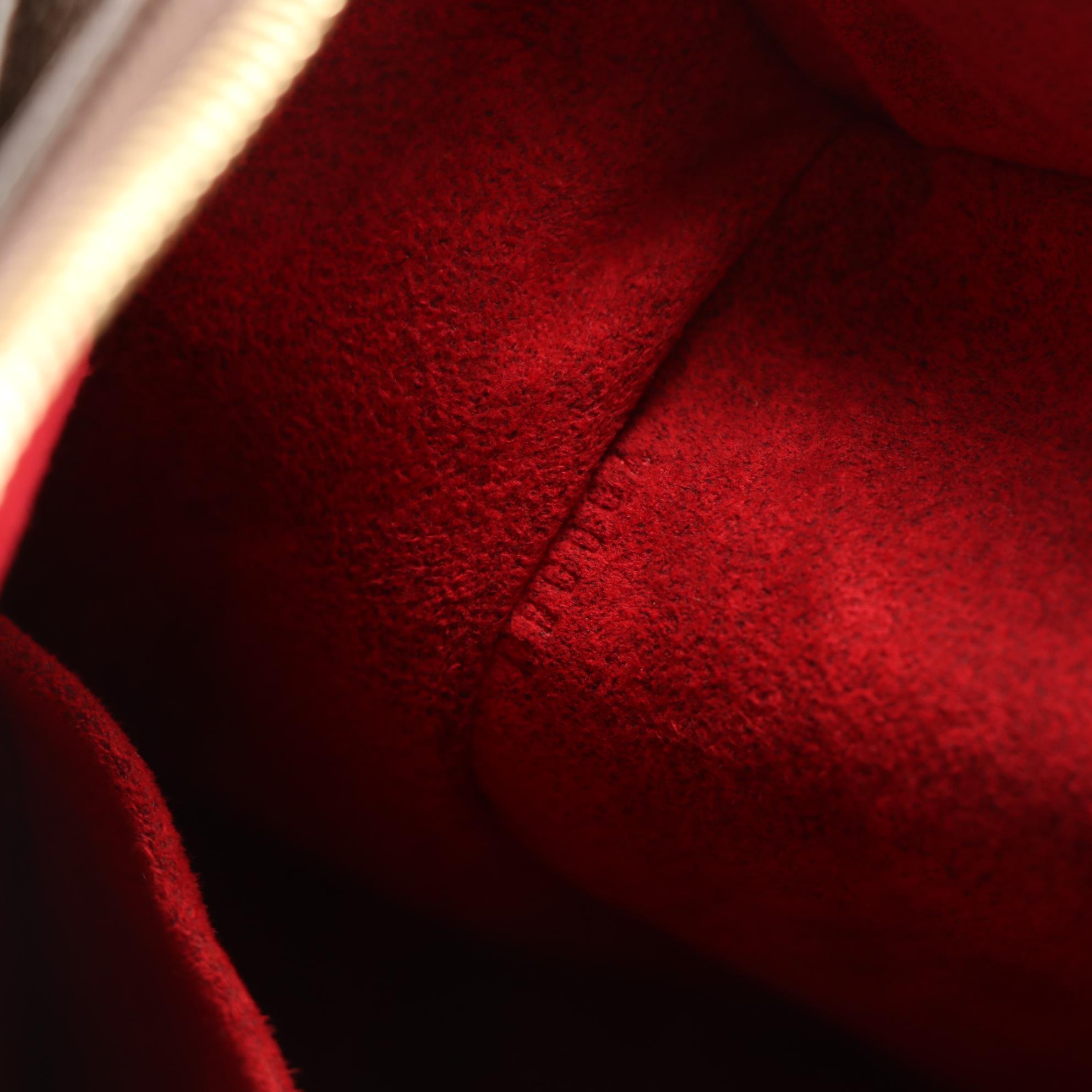 Louis Vuitton Multipli Cite Handbag in Monogram Canvas and Vachetta Leather