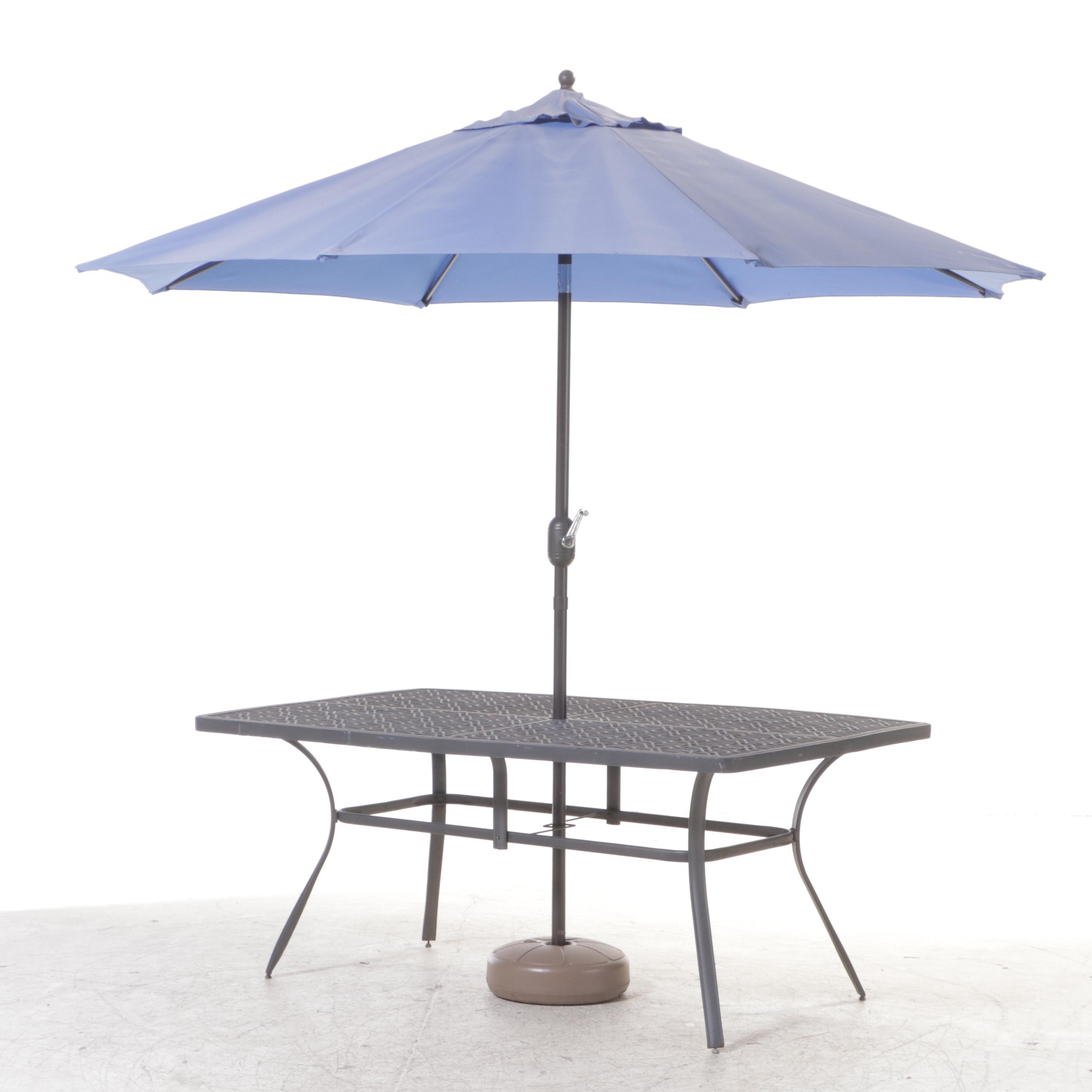 Seven-Piece Cast Metal Patio Dining Set with Umbrella