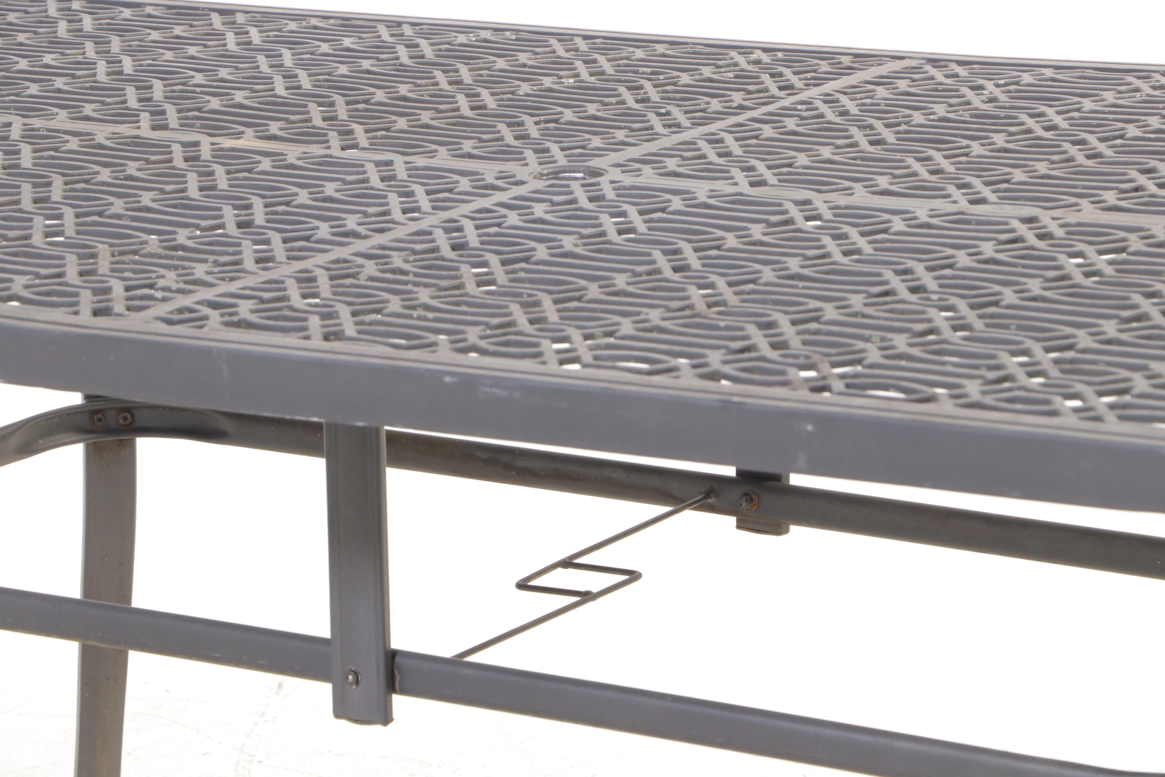 Seven-Piece Cast Metal Patio Dining Set with Umbrella