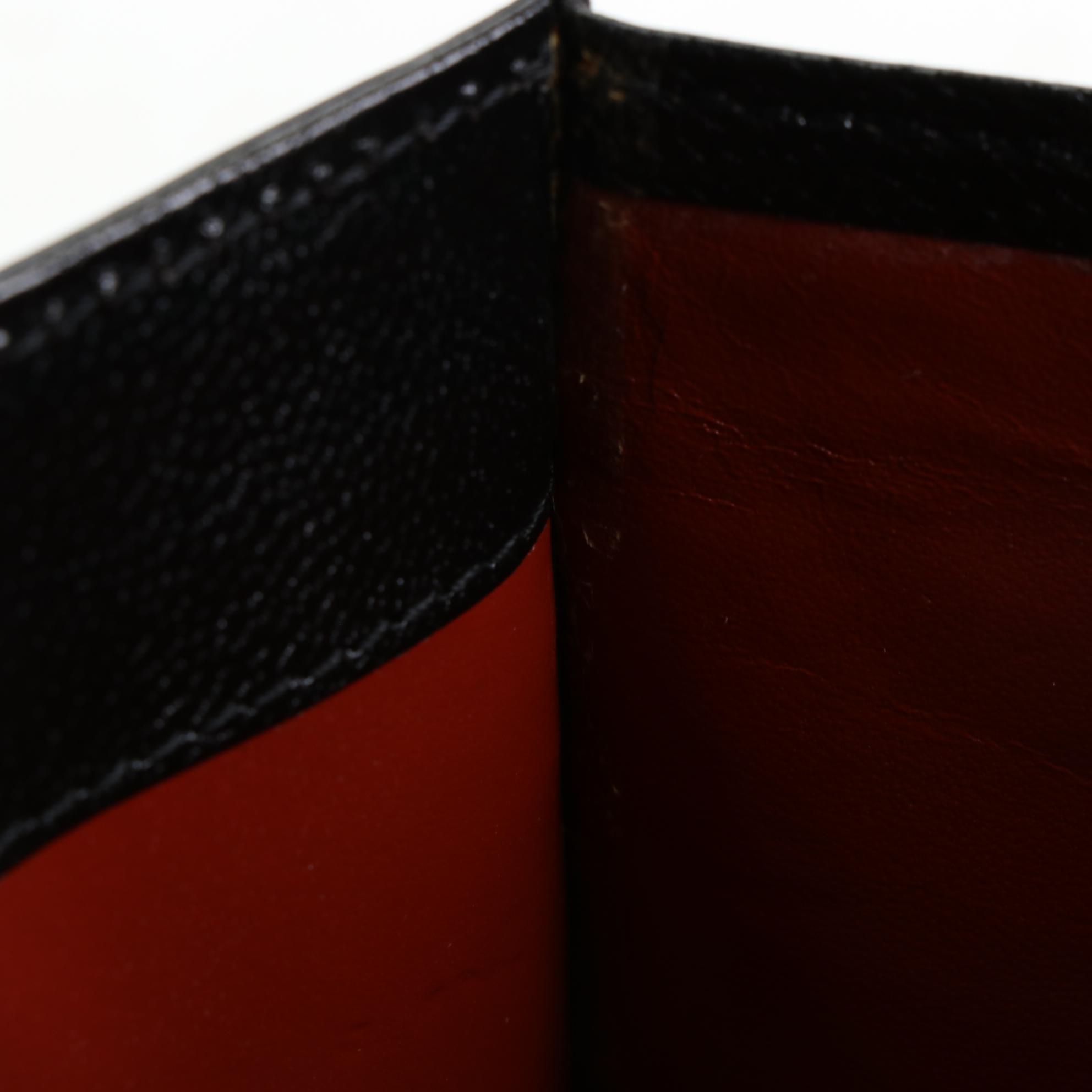 Yves Saint Laurent Convertible Clutch in Lizard Skin/Leather with Brogue Detail