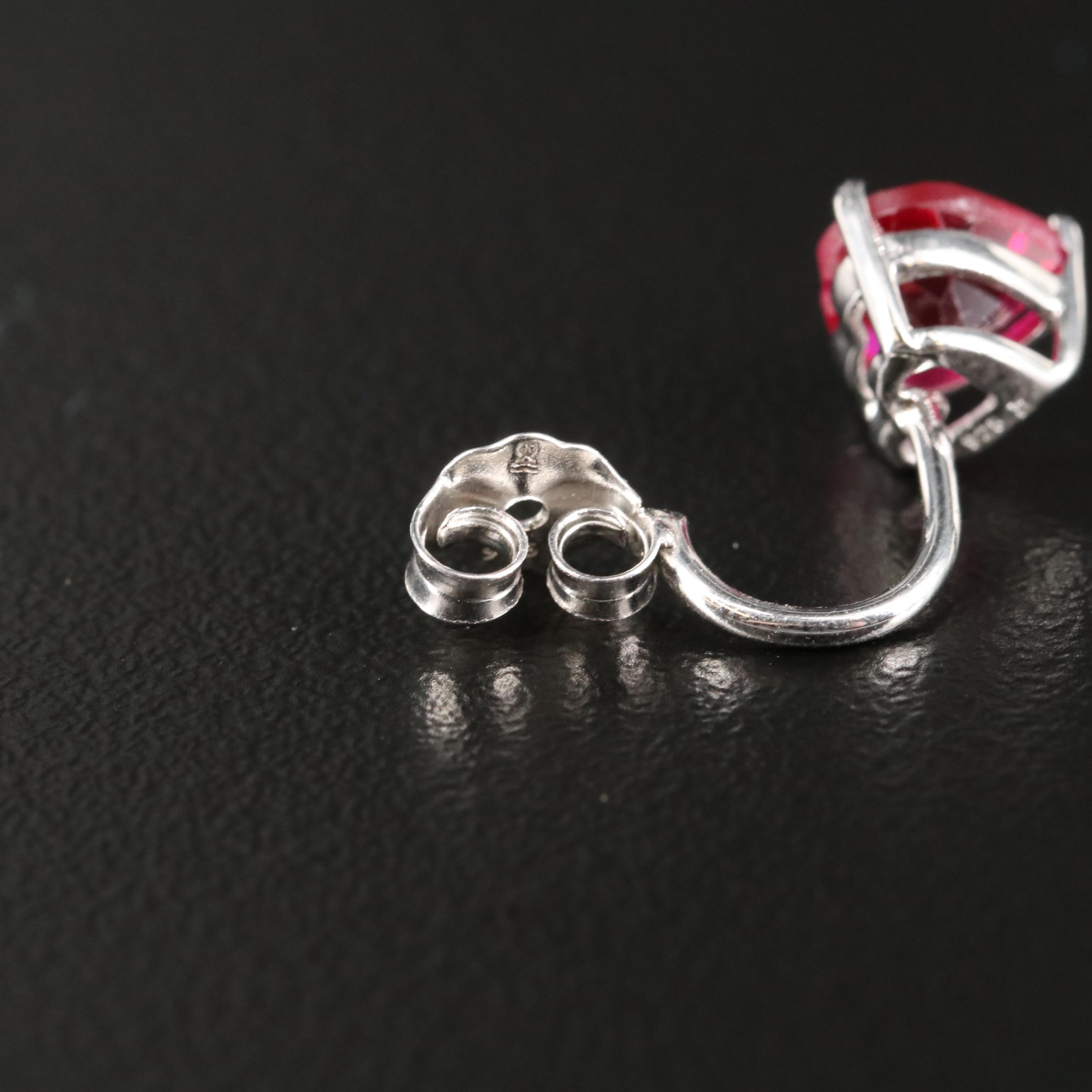 Sterling Cubic Zirconia Stud Earrings with Ruby Enhancers