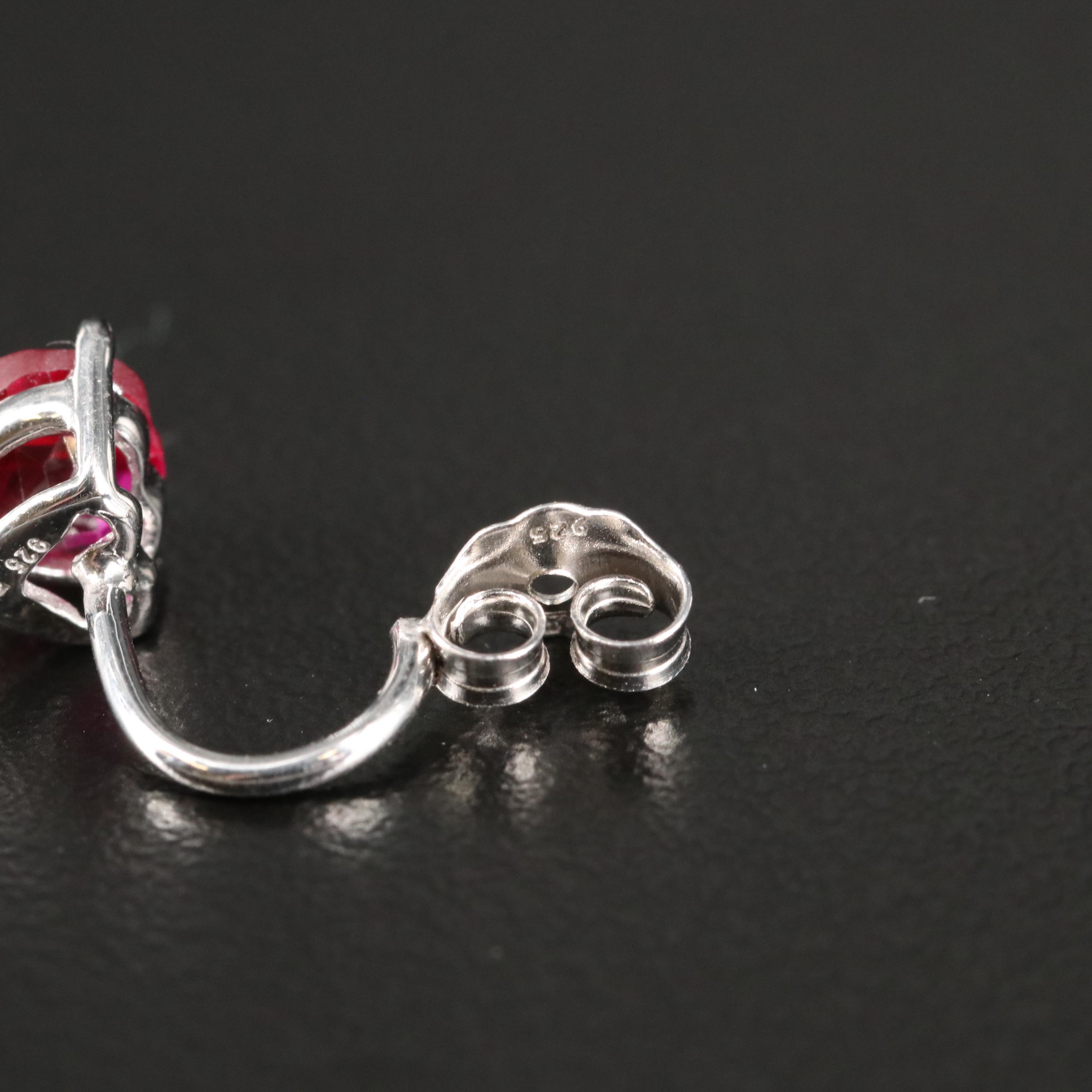 Sterling Cubic Zirconia Stud Earrings with Ruby Enhancers