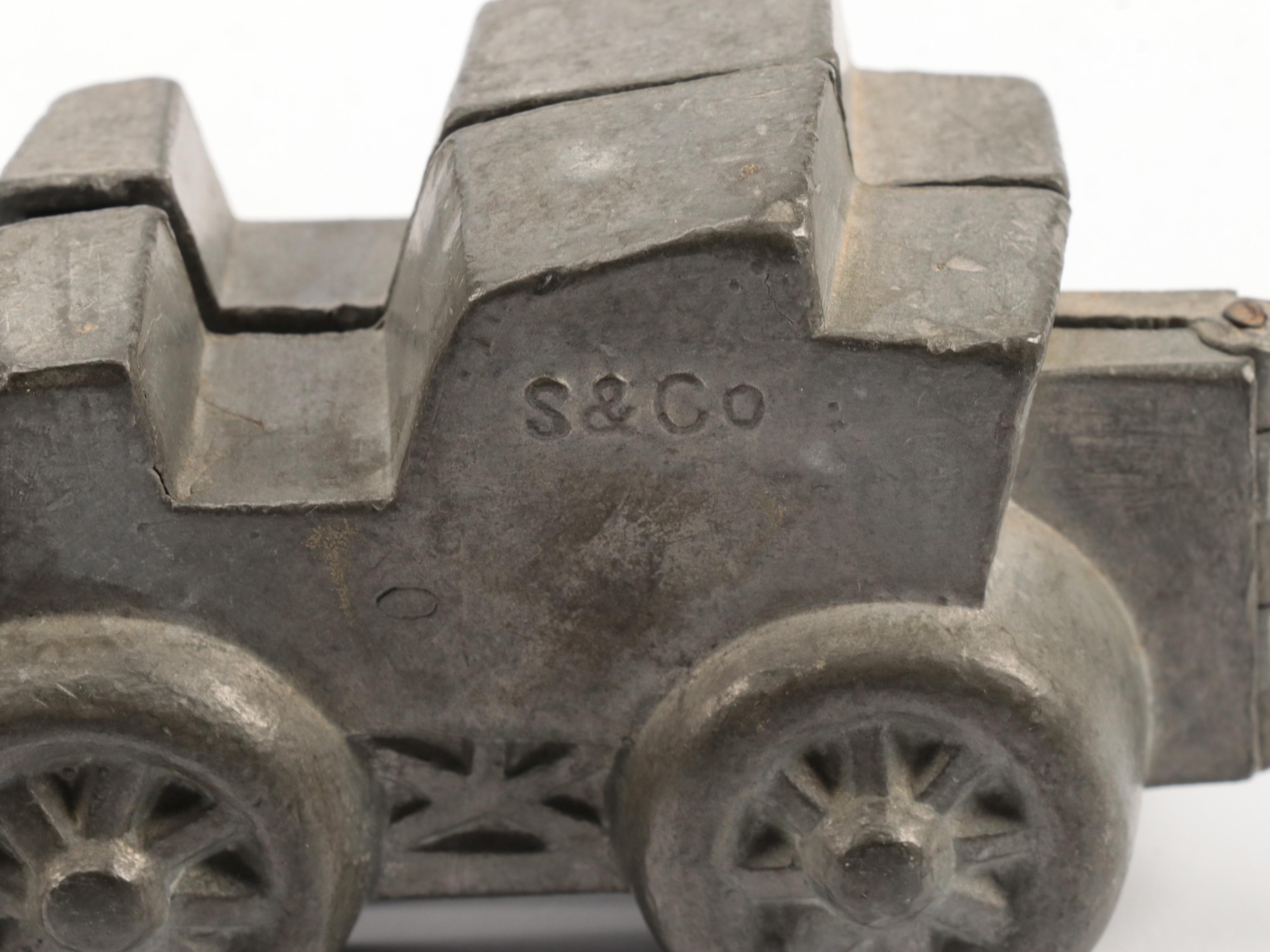 VormenFabriek with Other Metal Molds, Oil Lanterns, Creamer and Sugar