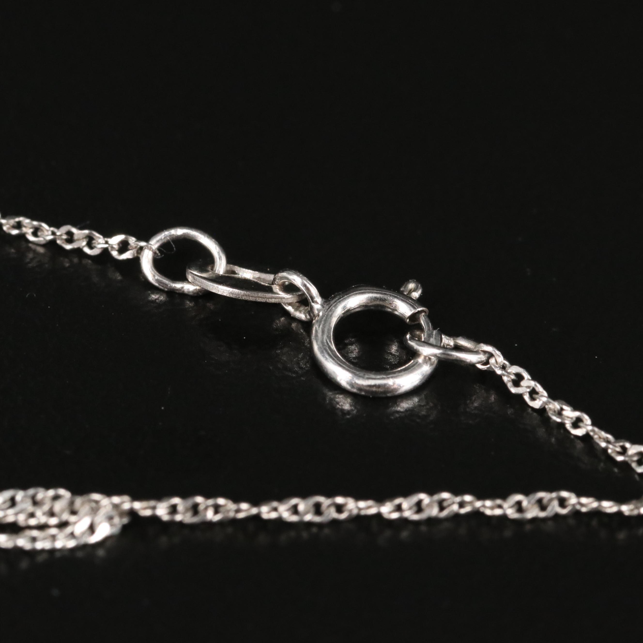 Sterling White Spinel, Sky Blue Topaz and White Sapphire Owl Shimmer Necklace