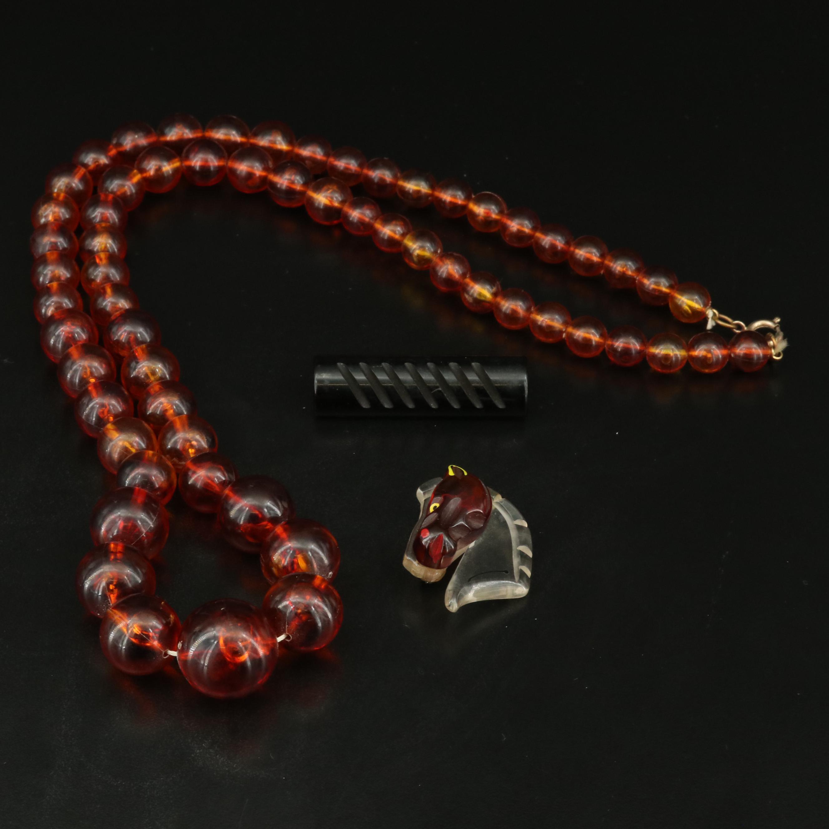 Graduated Plastic and Lucite Bead Necklace and Brooches