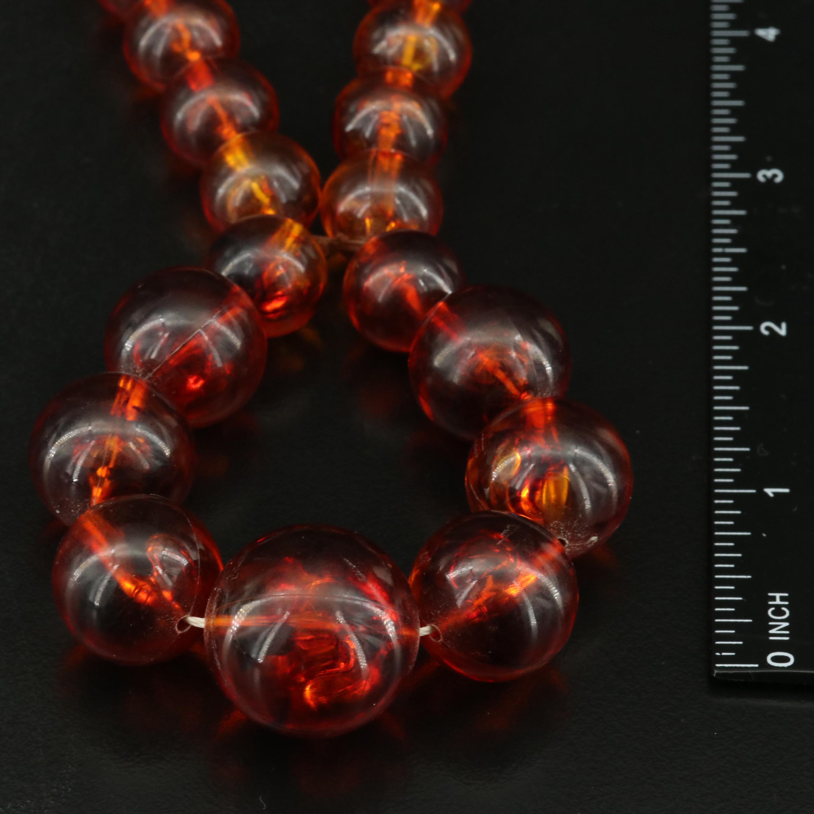 Graduated Plastic and Lucite Bead Necklace and Brooches